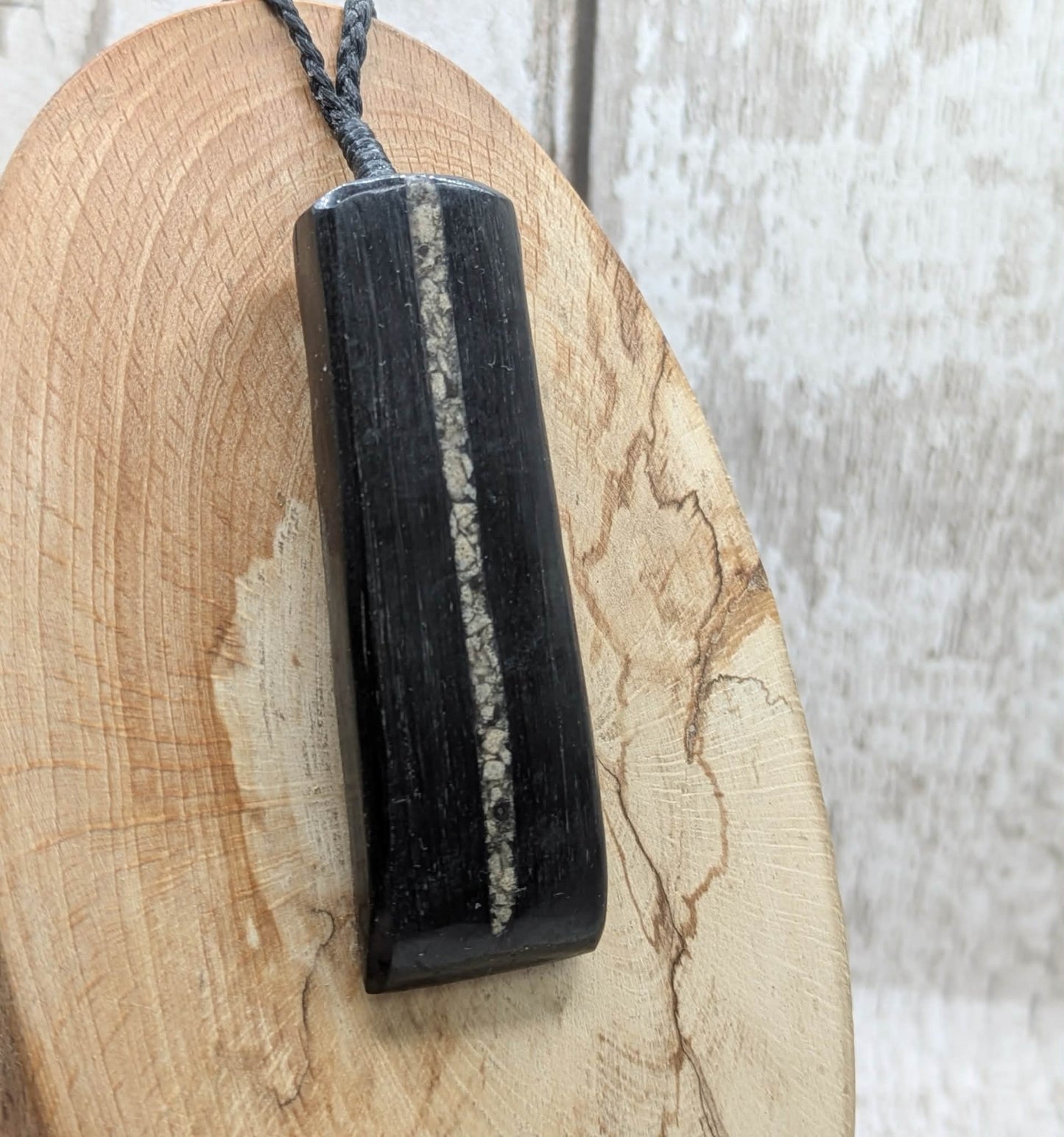 Fenland bog oak pendant with Avebury Sarsen inlay.