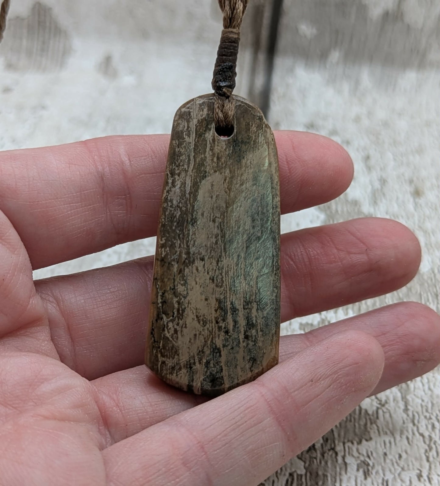Stable British mammoth ivory trust pendant from Oxfordshire.