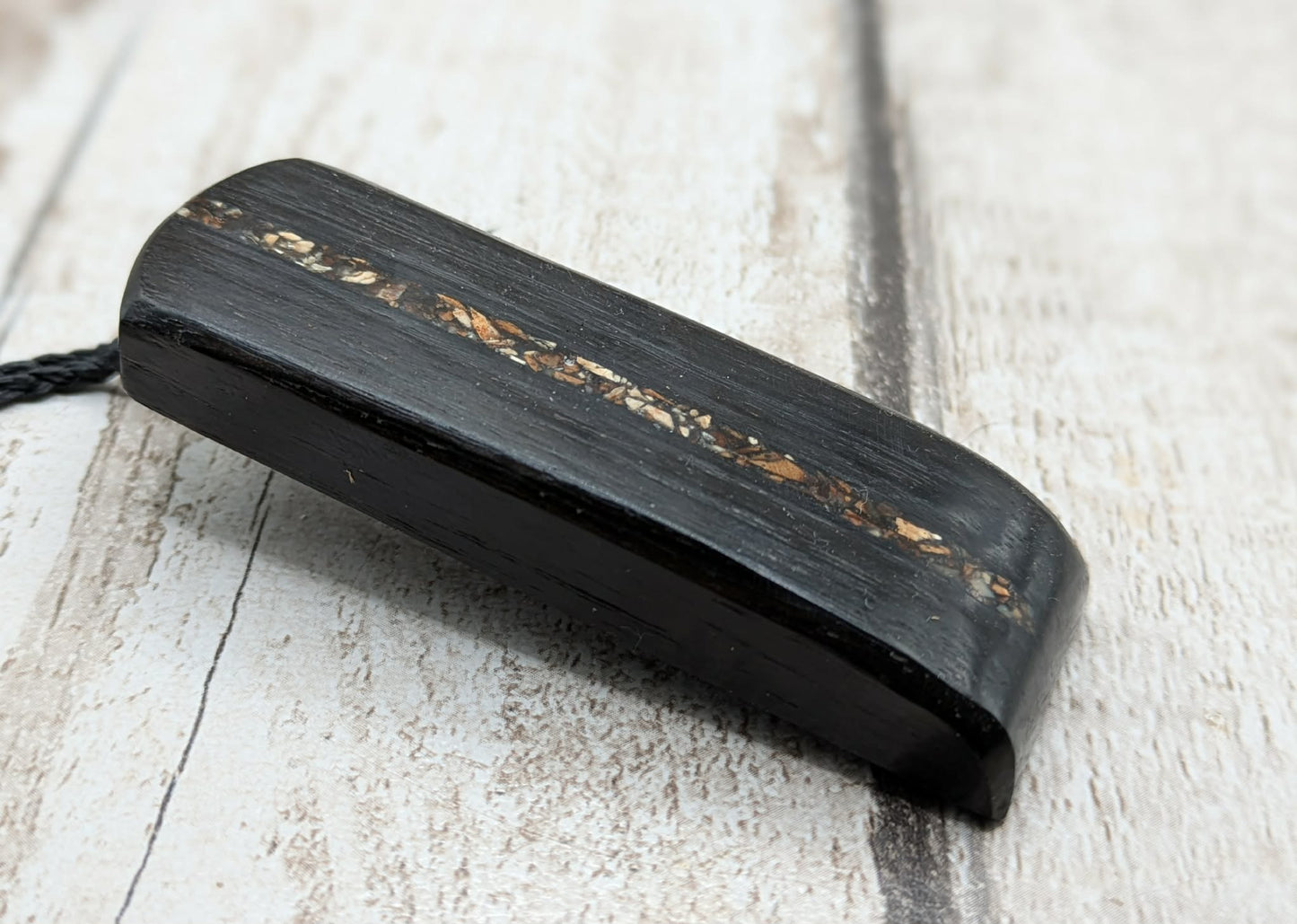 Fenland bog oak and mammoth ivory Toki adze style pendant.