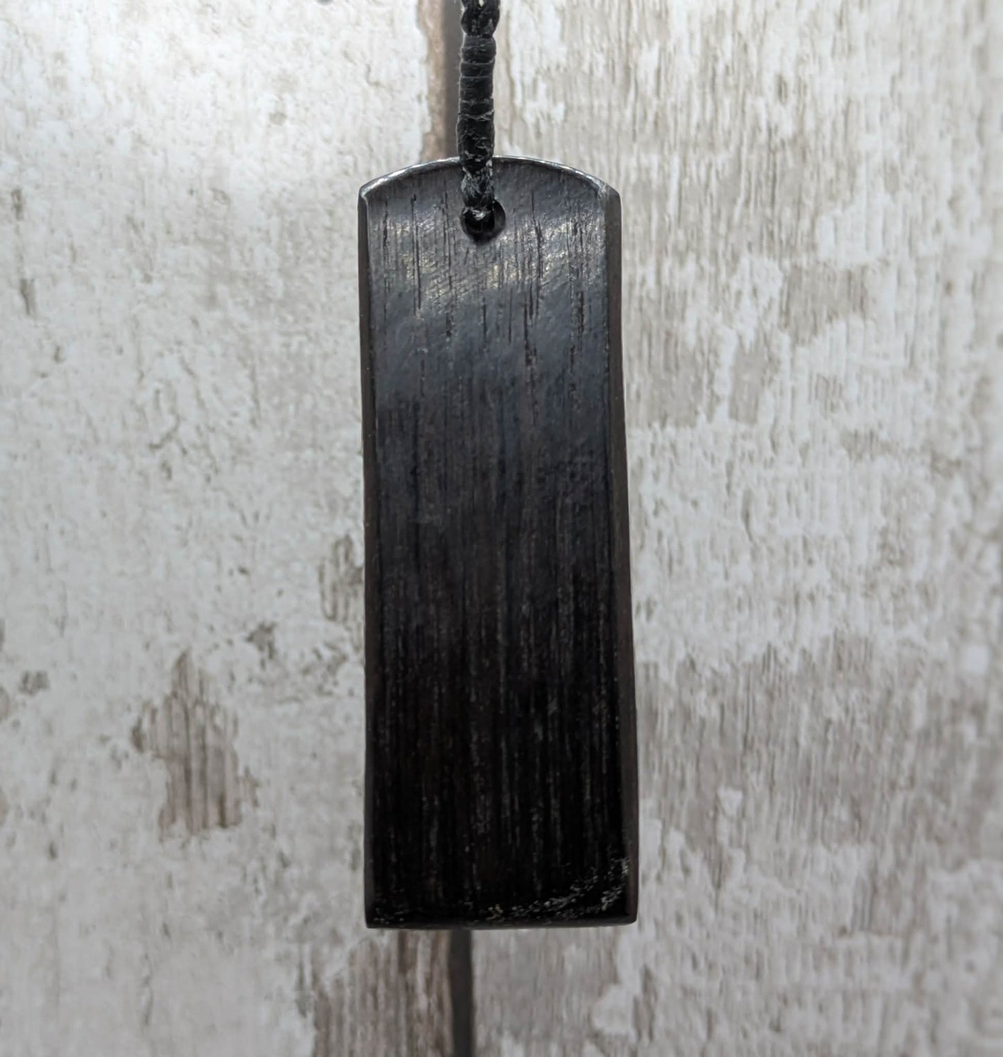 Fenland bog oak with mammoth tooth inlay, Toki adze style pendant.
