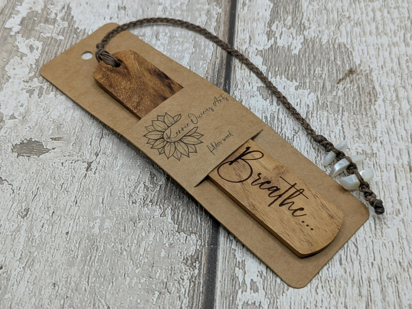 Handmade alder wooden laser printed breathe bookmark.