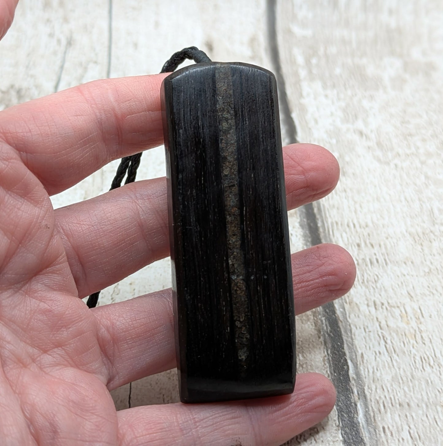 Fenland bog oak with mammoth tooth inlay, Toki adze style pendant.