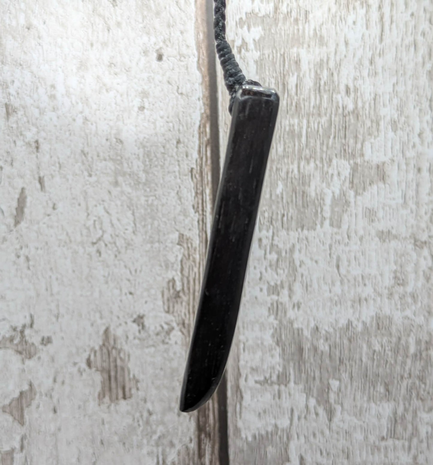 Fenland bog oak pendant with Avebury Sarsen inlay.