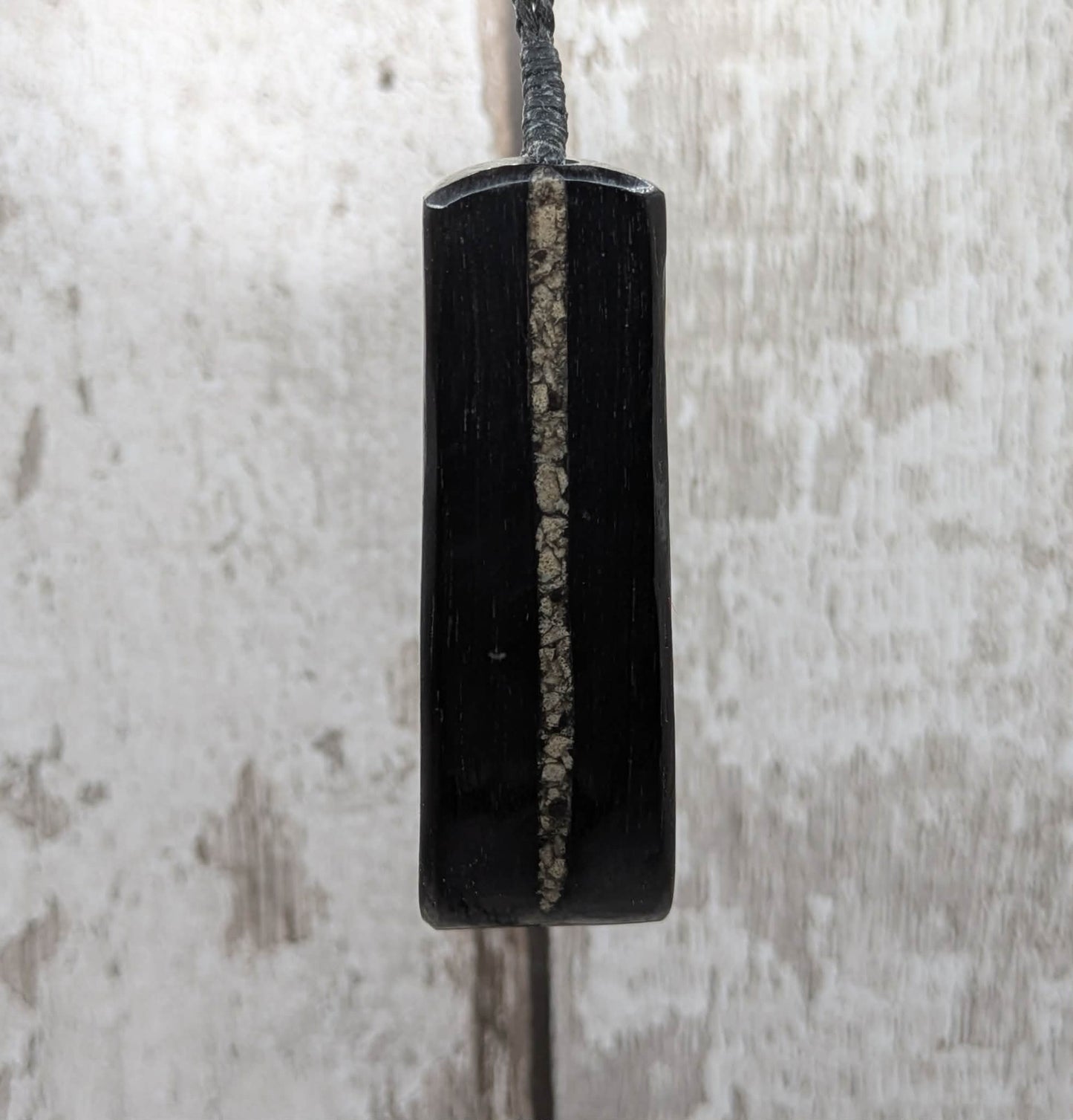 Fenland bog oak pendant with Avebury Sarsen inlay.