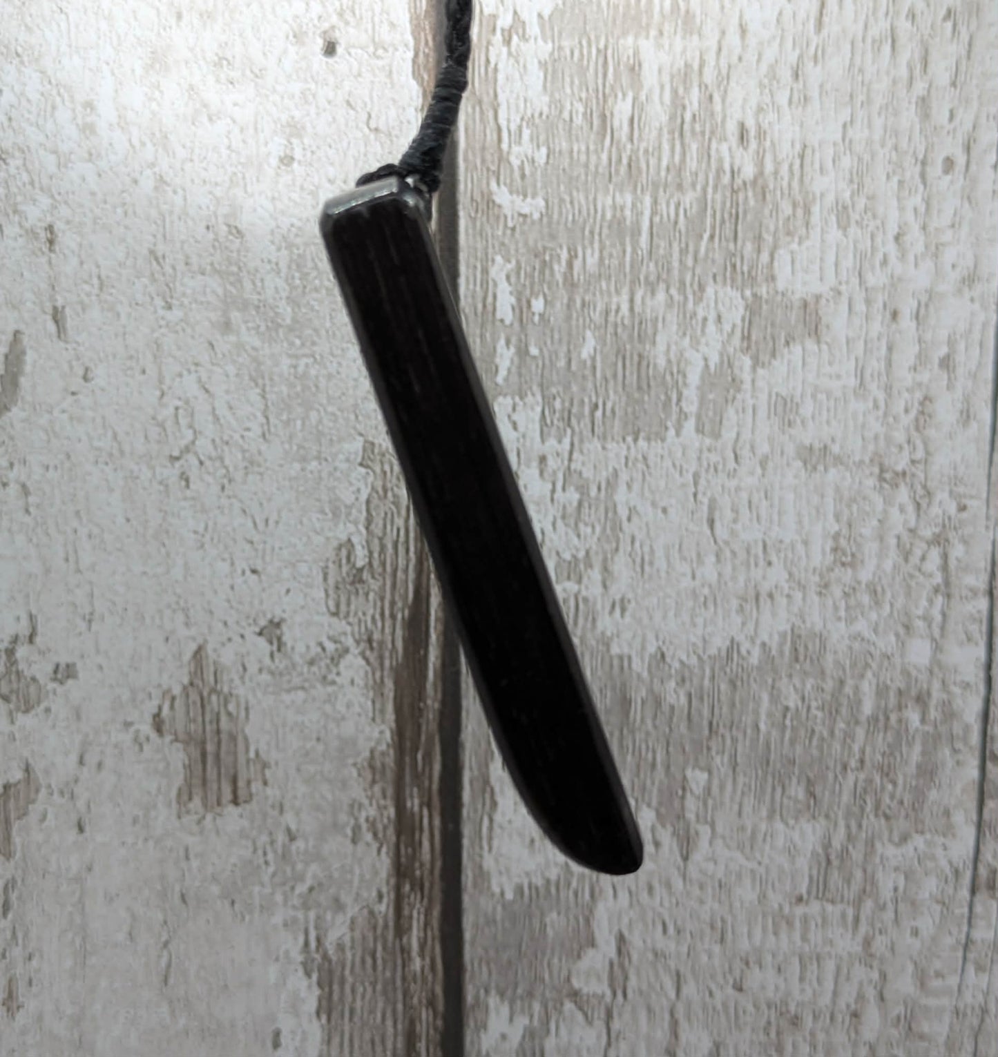 Fenland bog oak with mammoth tooth inlay, Toki adze style pendant.