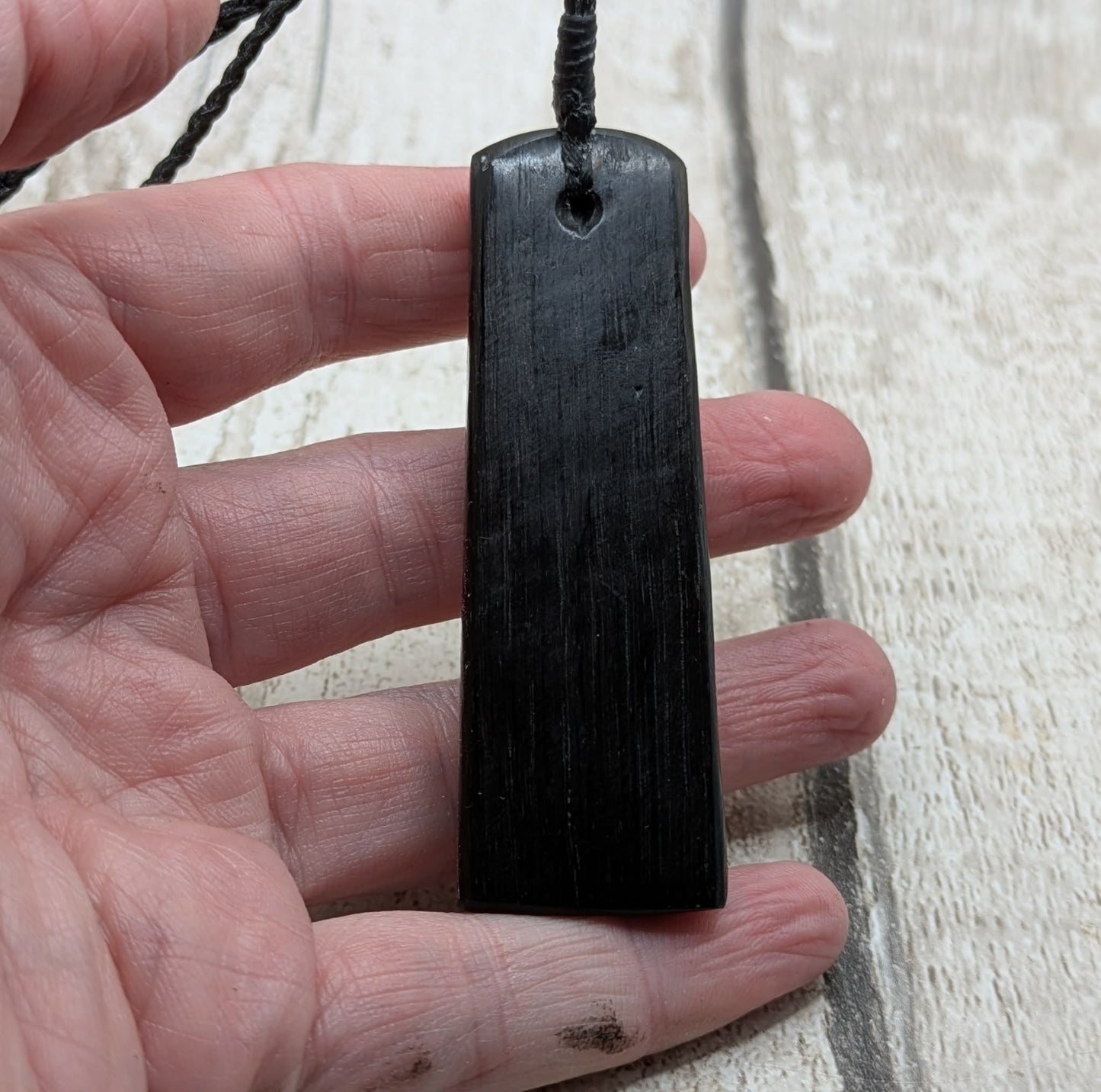 Fenland bog oak pendant with Avebury Sarsen inlay.