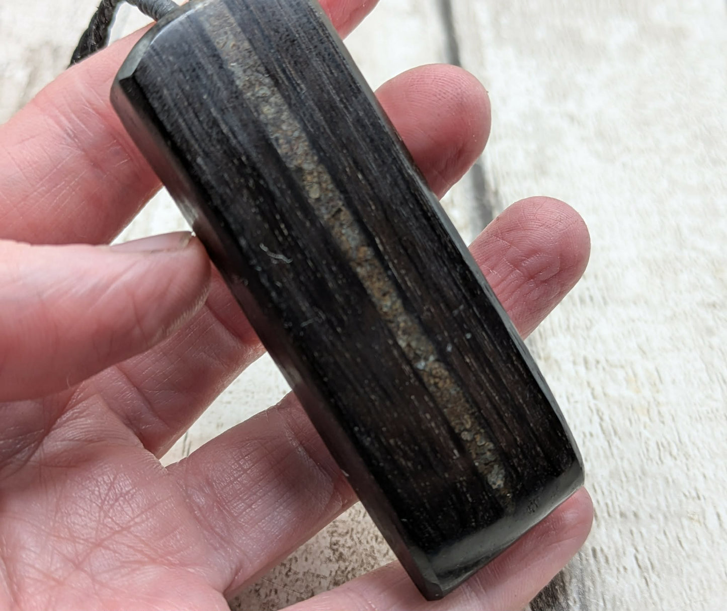 Fenland bog oak with mammoth tooth inlay, Toki adze style pendant.
