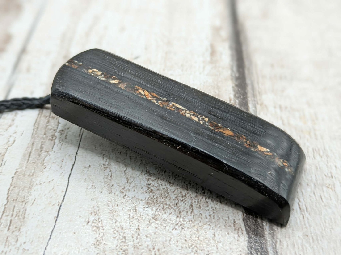 Fenland bog oak and mammoth ivory Toki adze style pendant.