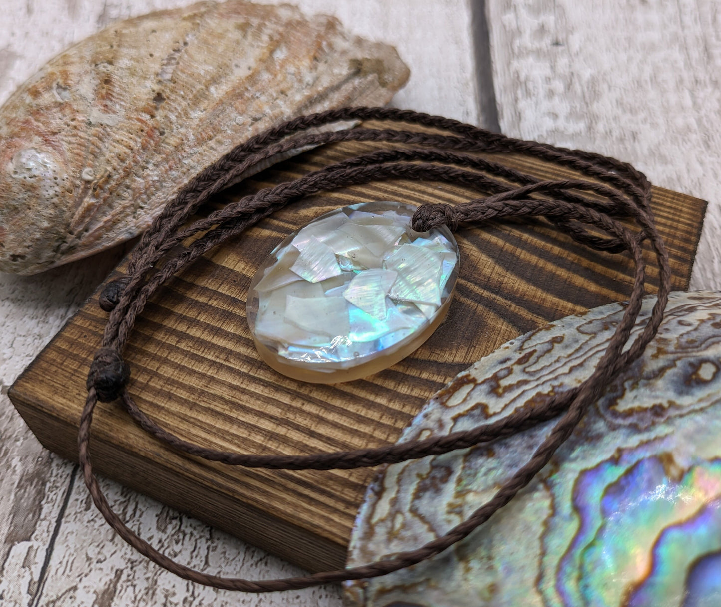Oyster shell in UV resin pendant.