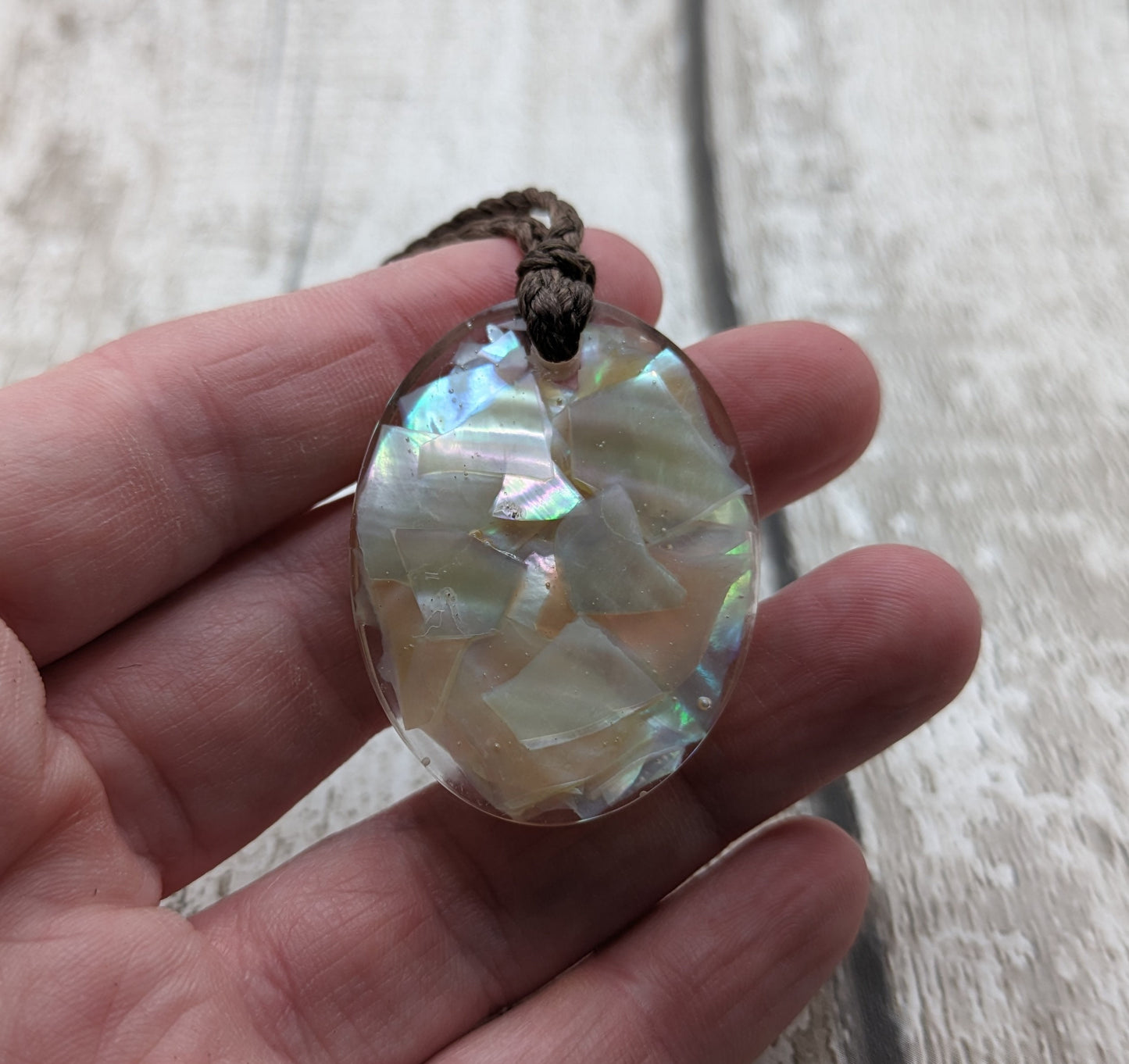 Oyster shell in UV resin pendant.