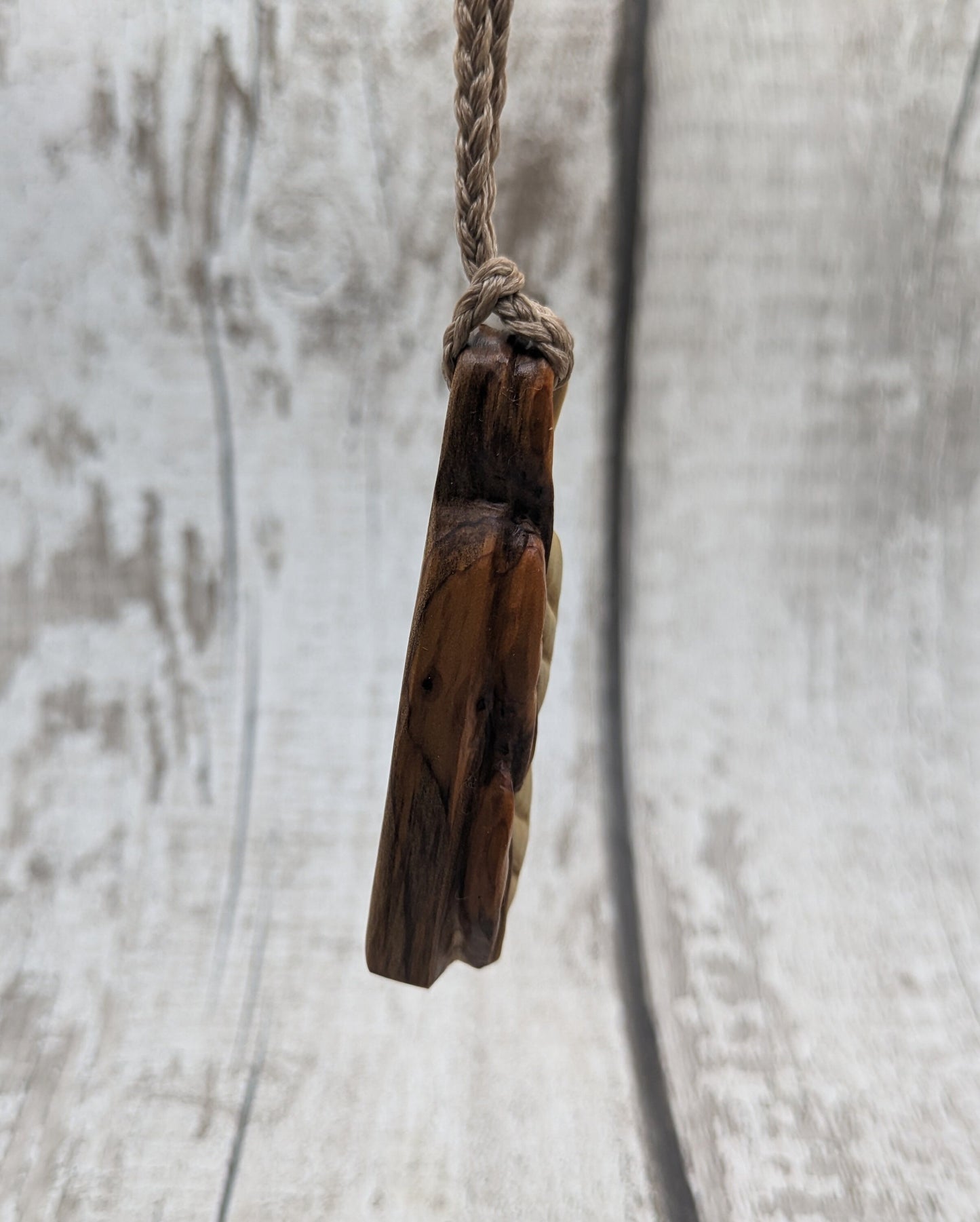 yew wood woodland leaves carved pendant.