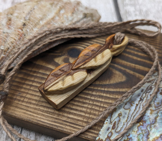 yew wood woodland leaves carved pendant.