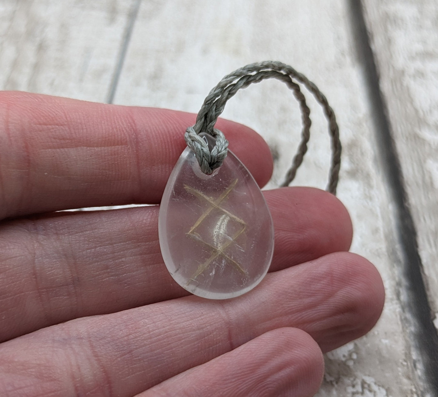 Ingwaz clear quartz rune palm stone pendant.