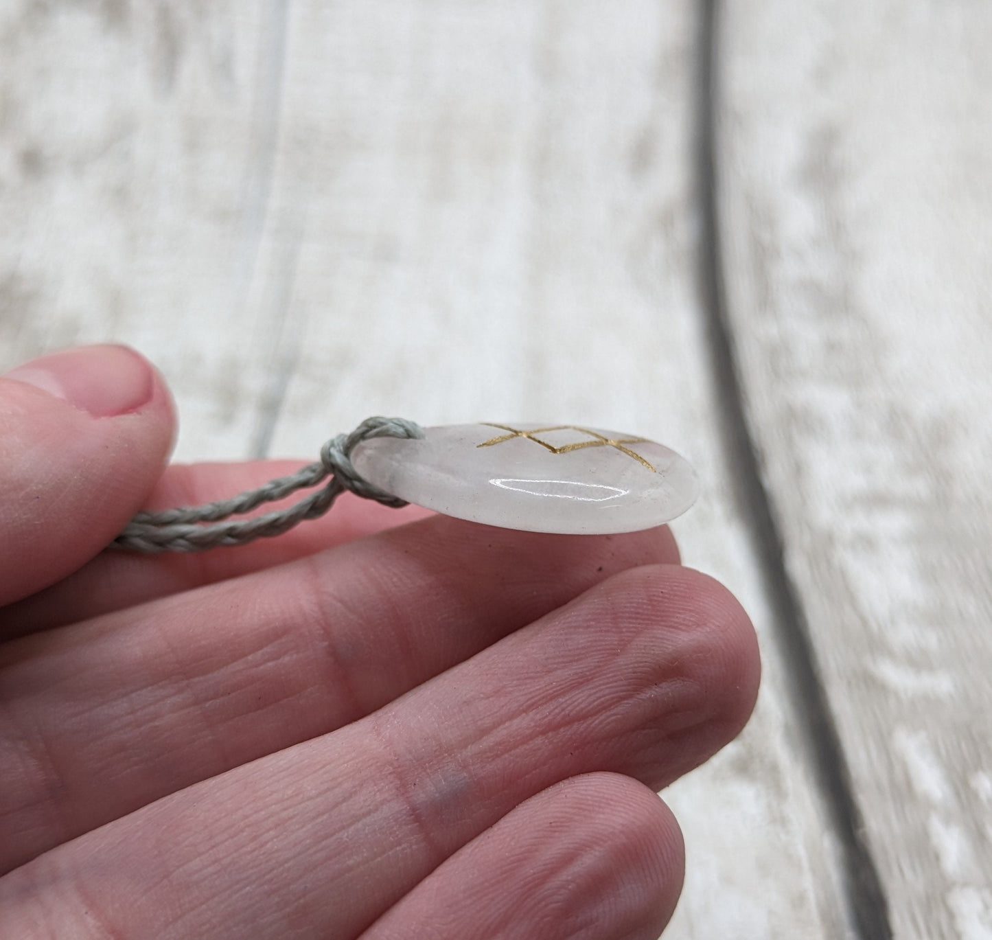 ingwaz quartz palm rune stone pendant.