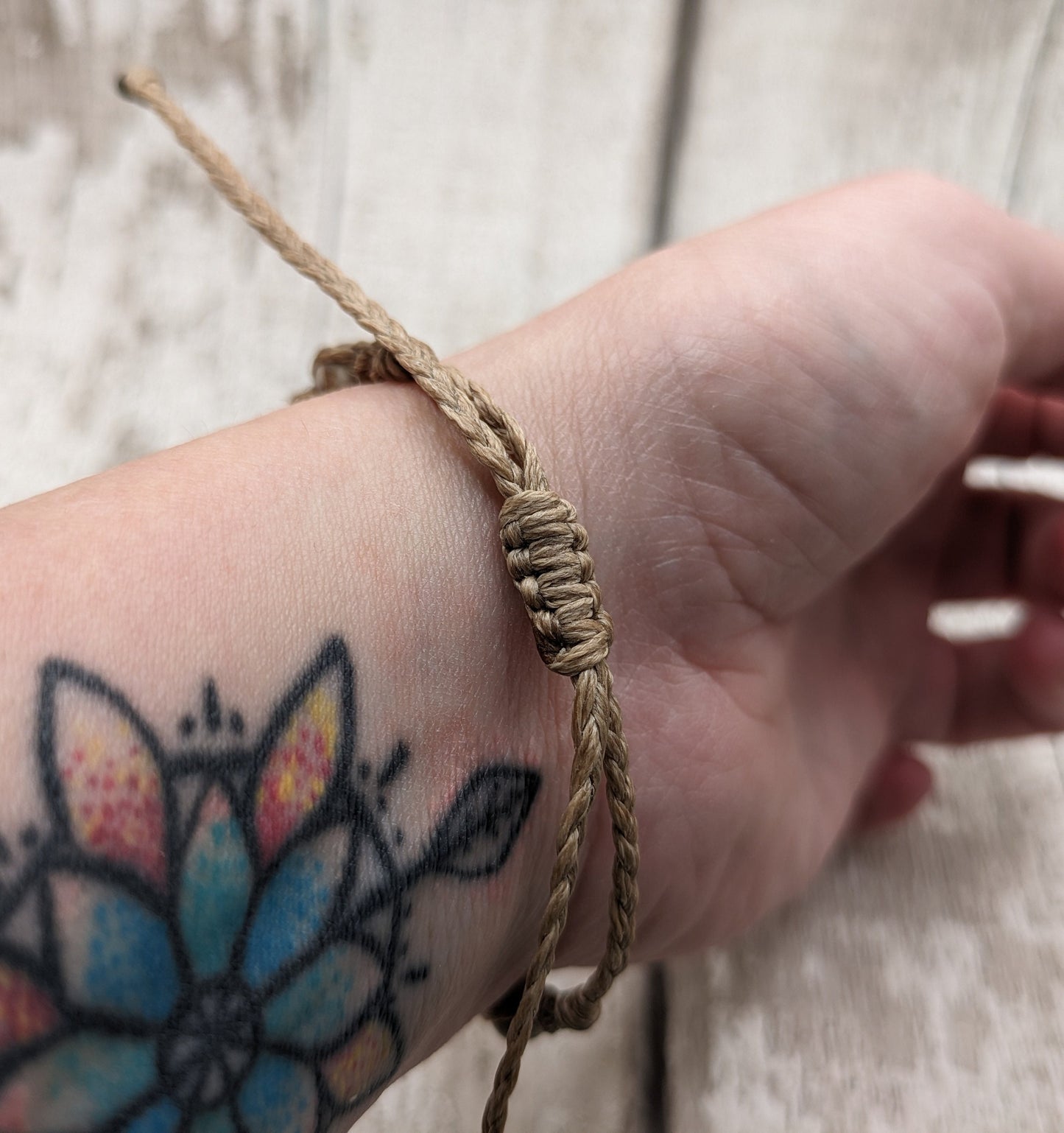 crianoid and fossilized coral beaded macrame bracelet.