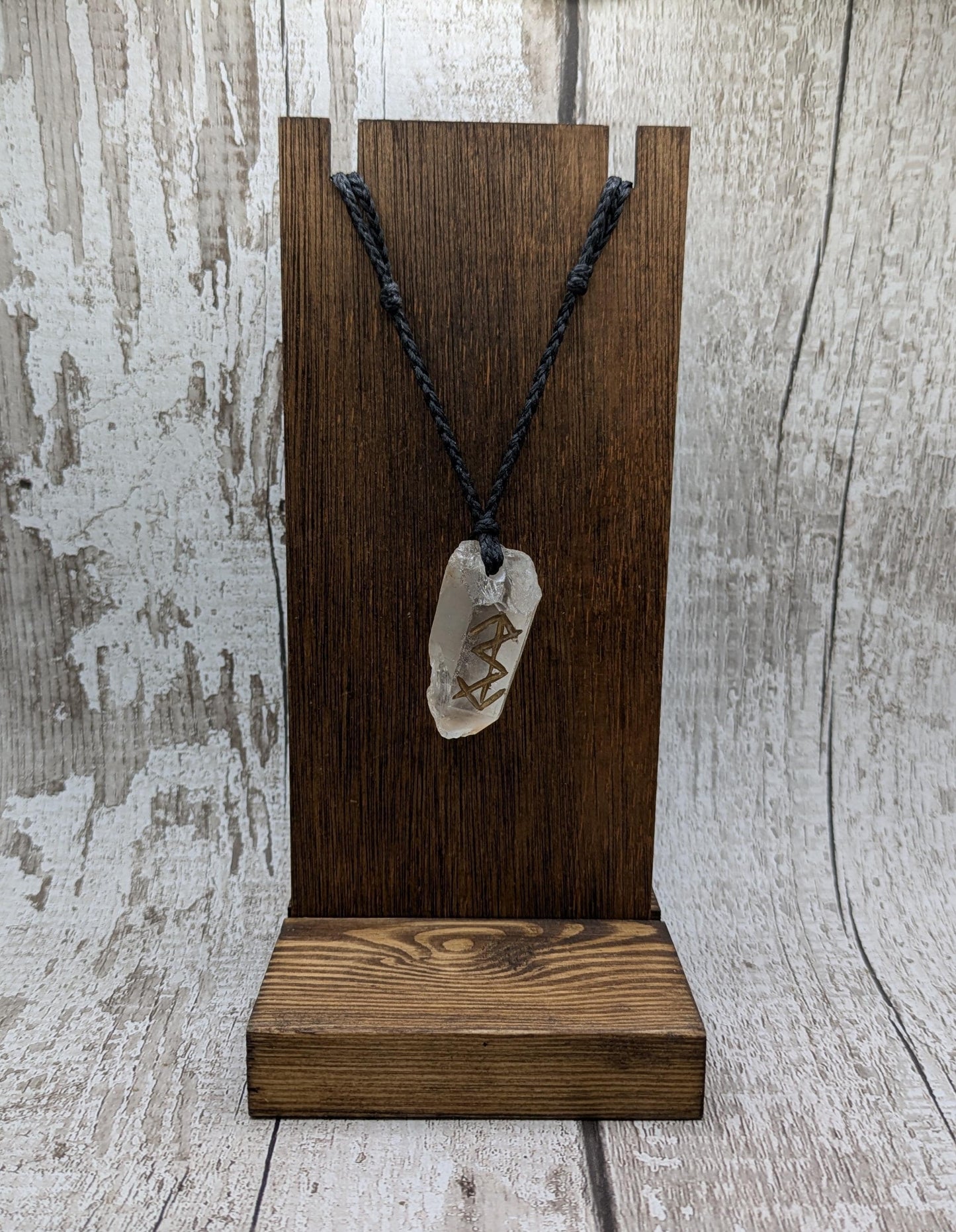 Clear quartz point bind rune empowerment pendant.