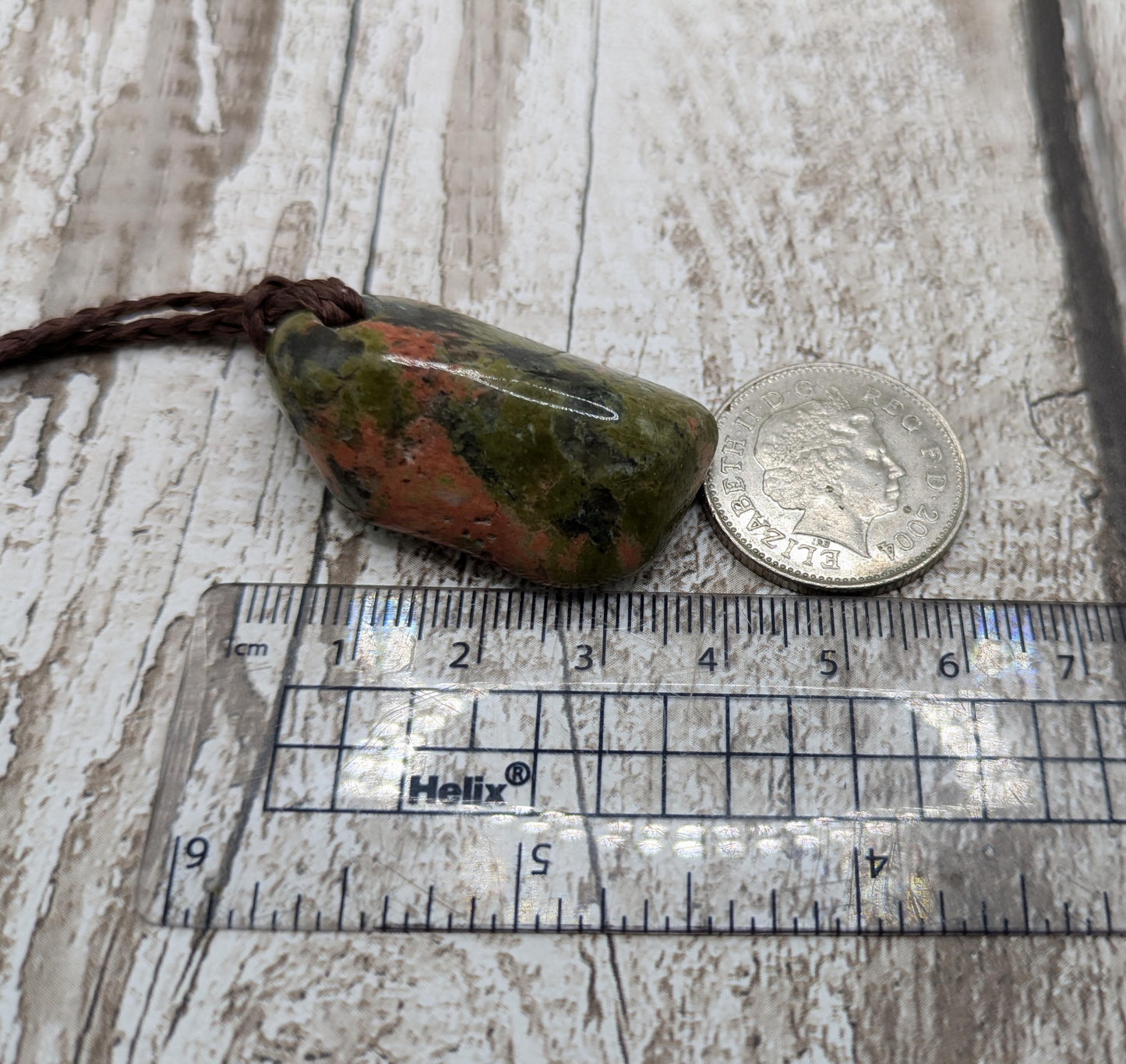 unakite tumbled stone pendant.