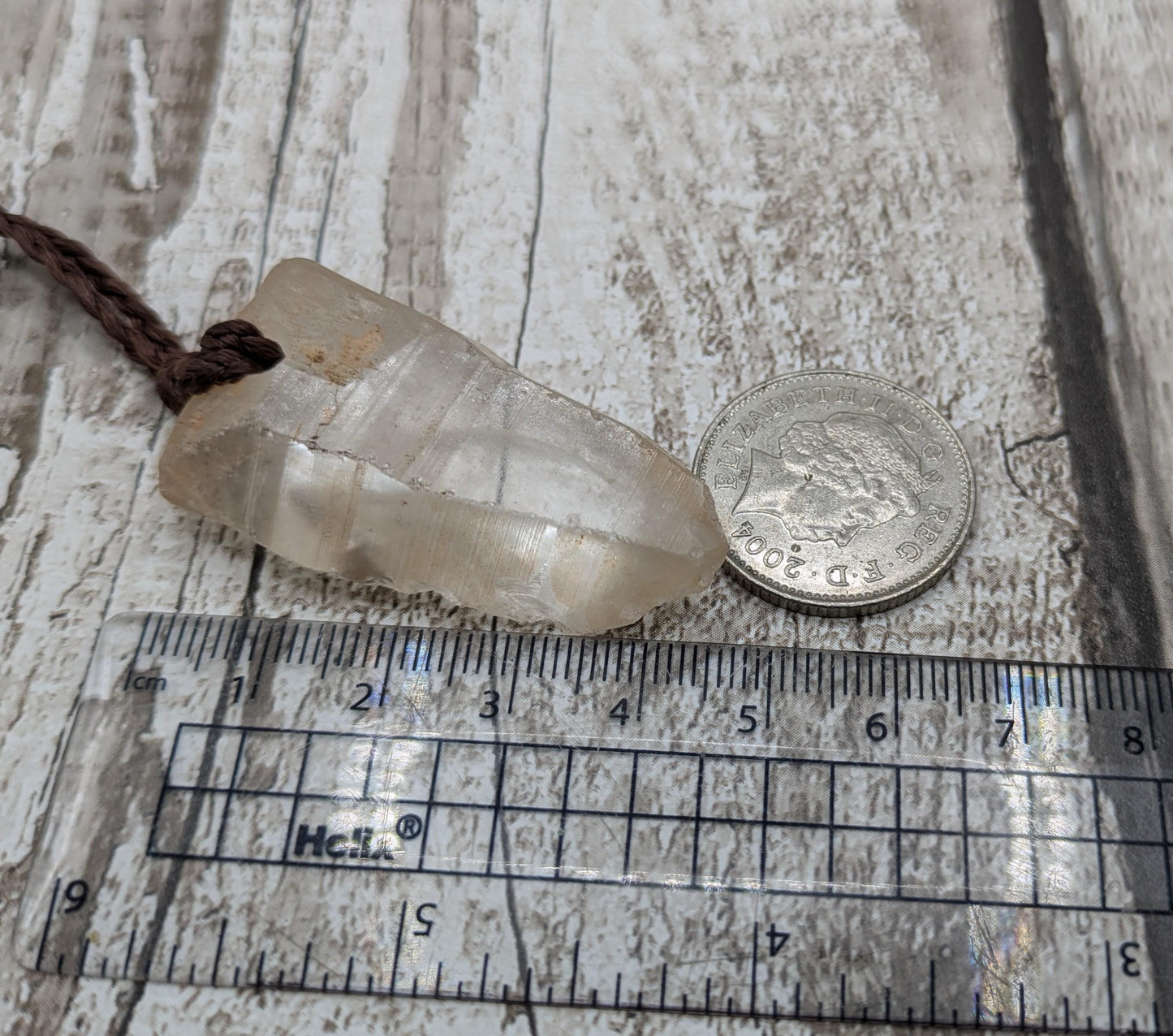 clear quartz crystal point pendant.