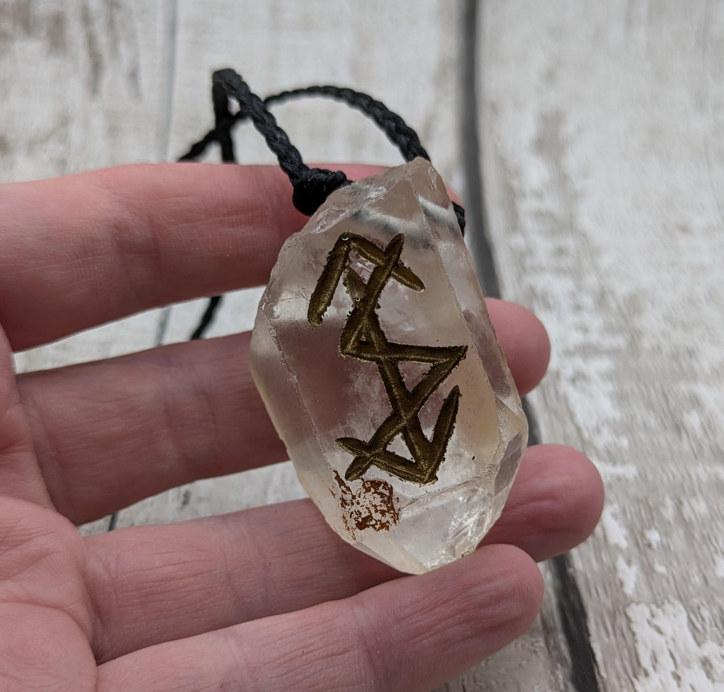 clear crystal point bind rune stone pendant.