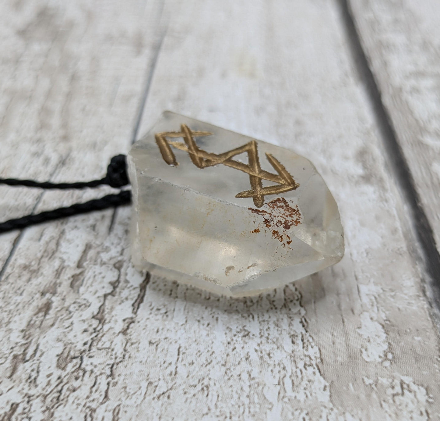 clear crystal point bind rune stone pendant.