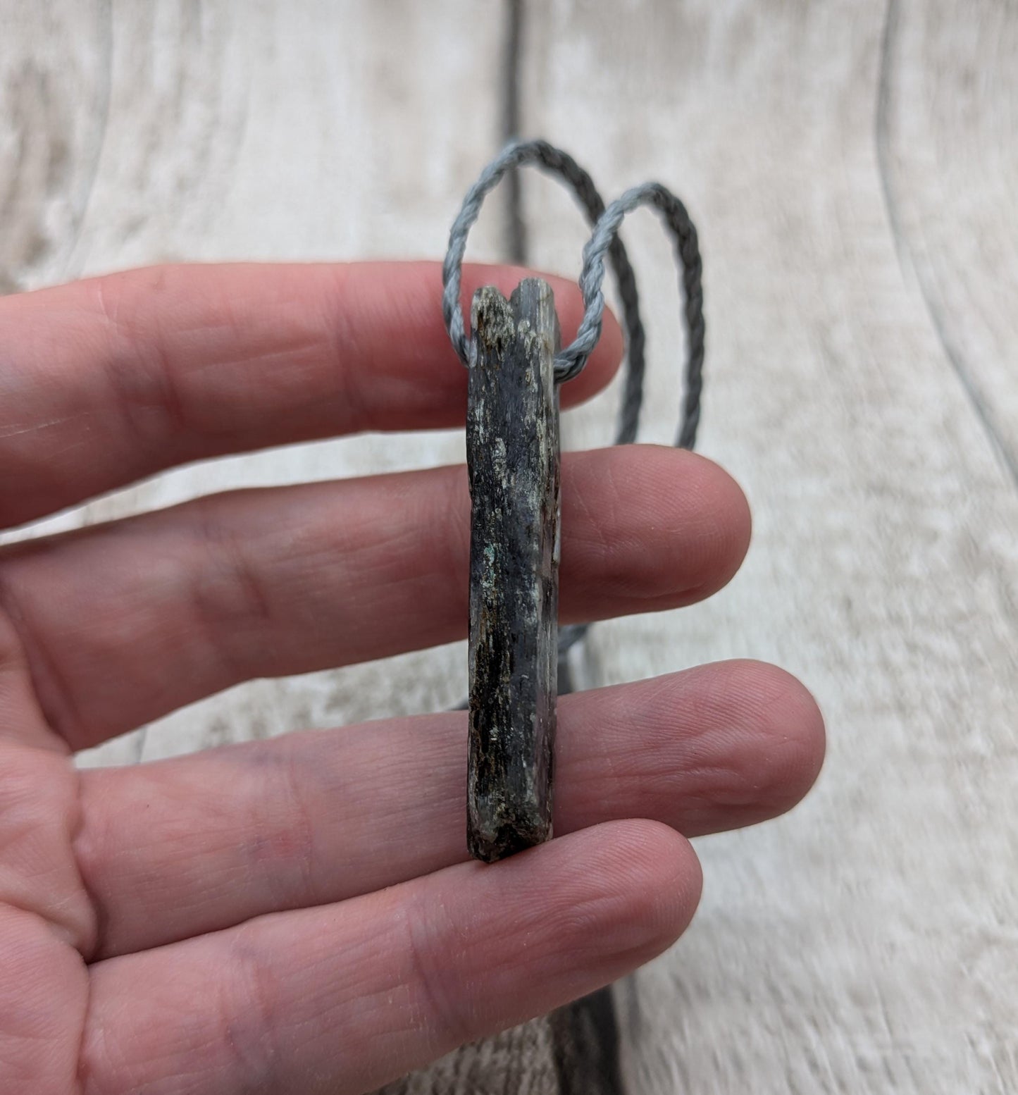 Raw kyanite pendant.