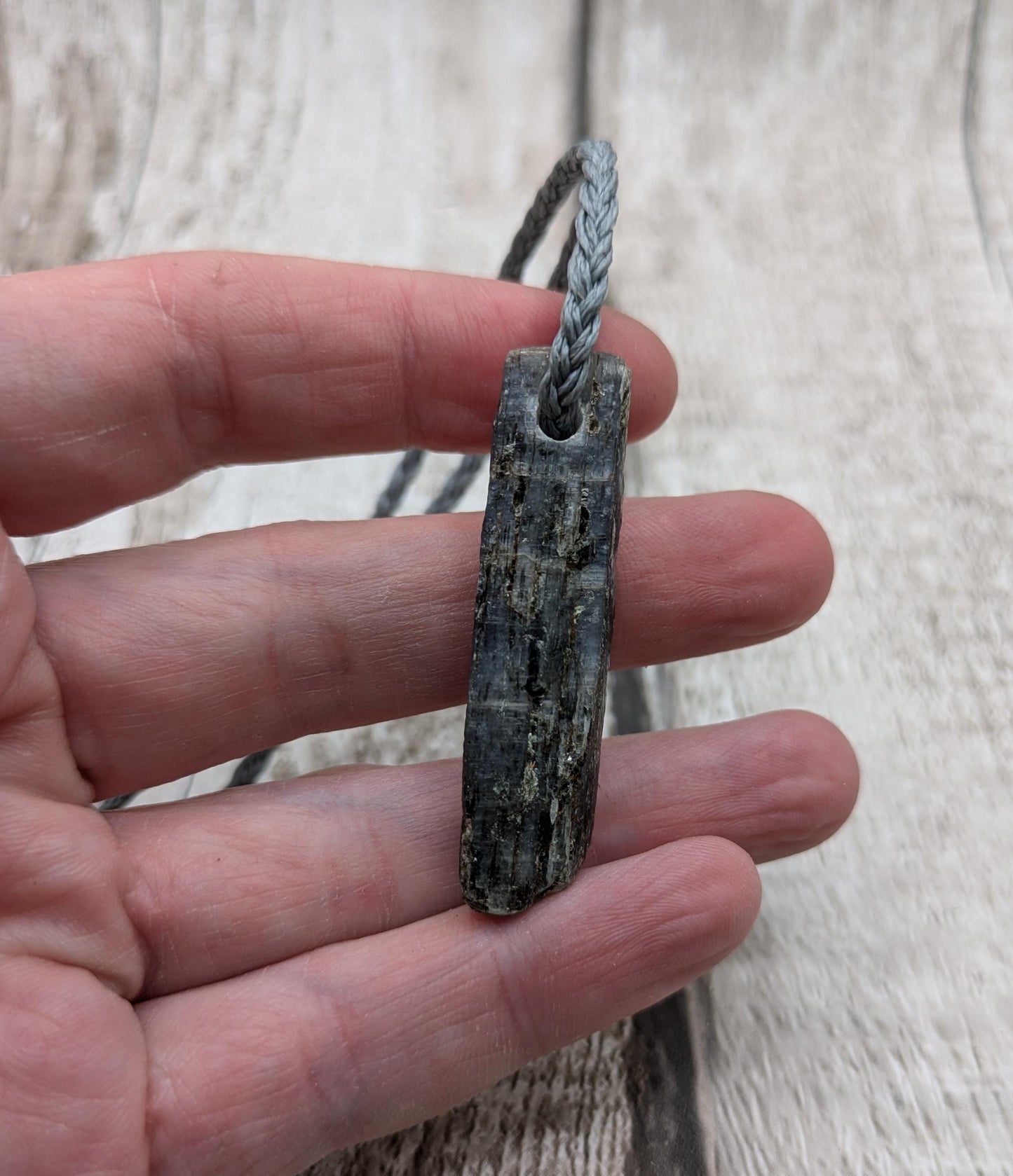 Raw kyanite pendant.