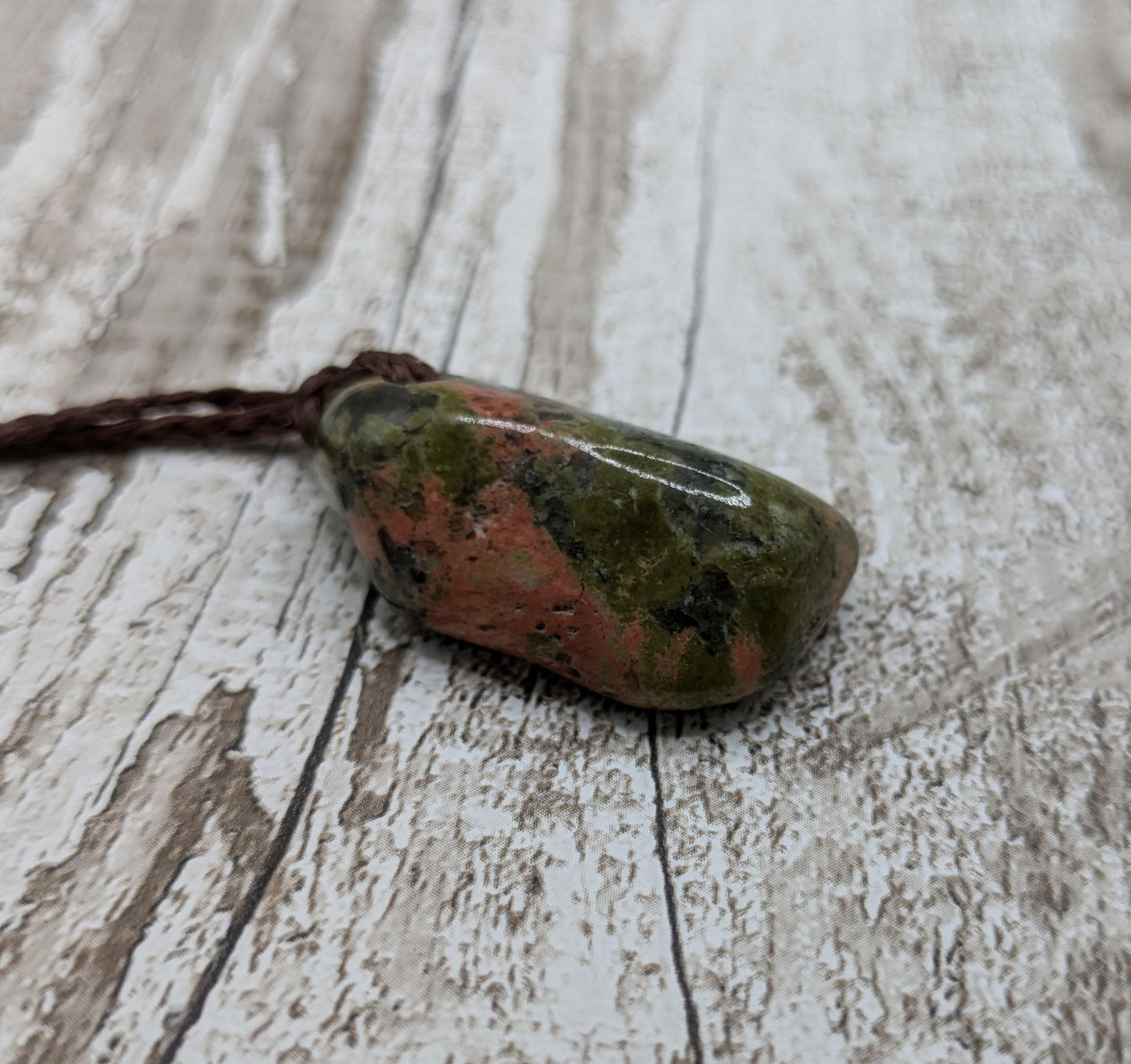 unakite tumbled stone pendant.