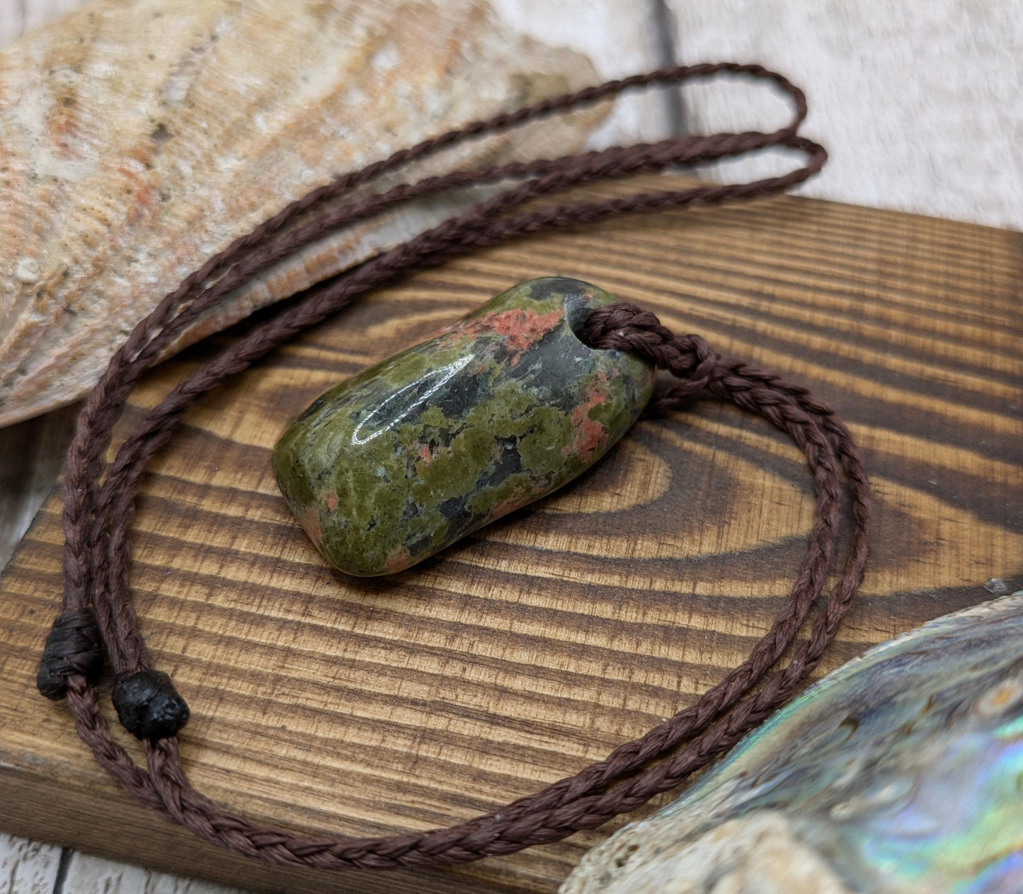 unakite tumbled stone pendant.