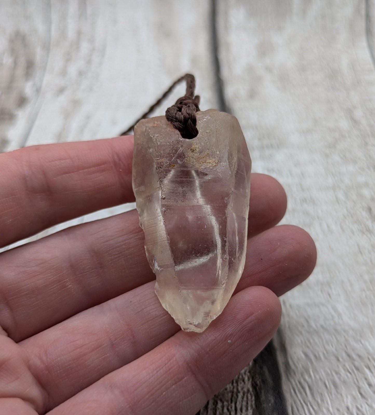 clear quartz crystal point pendant.