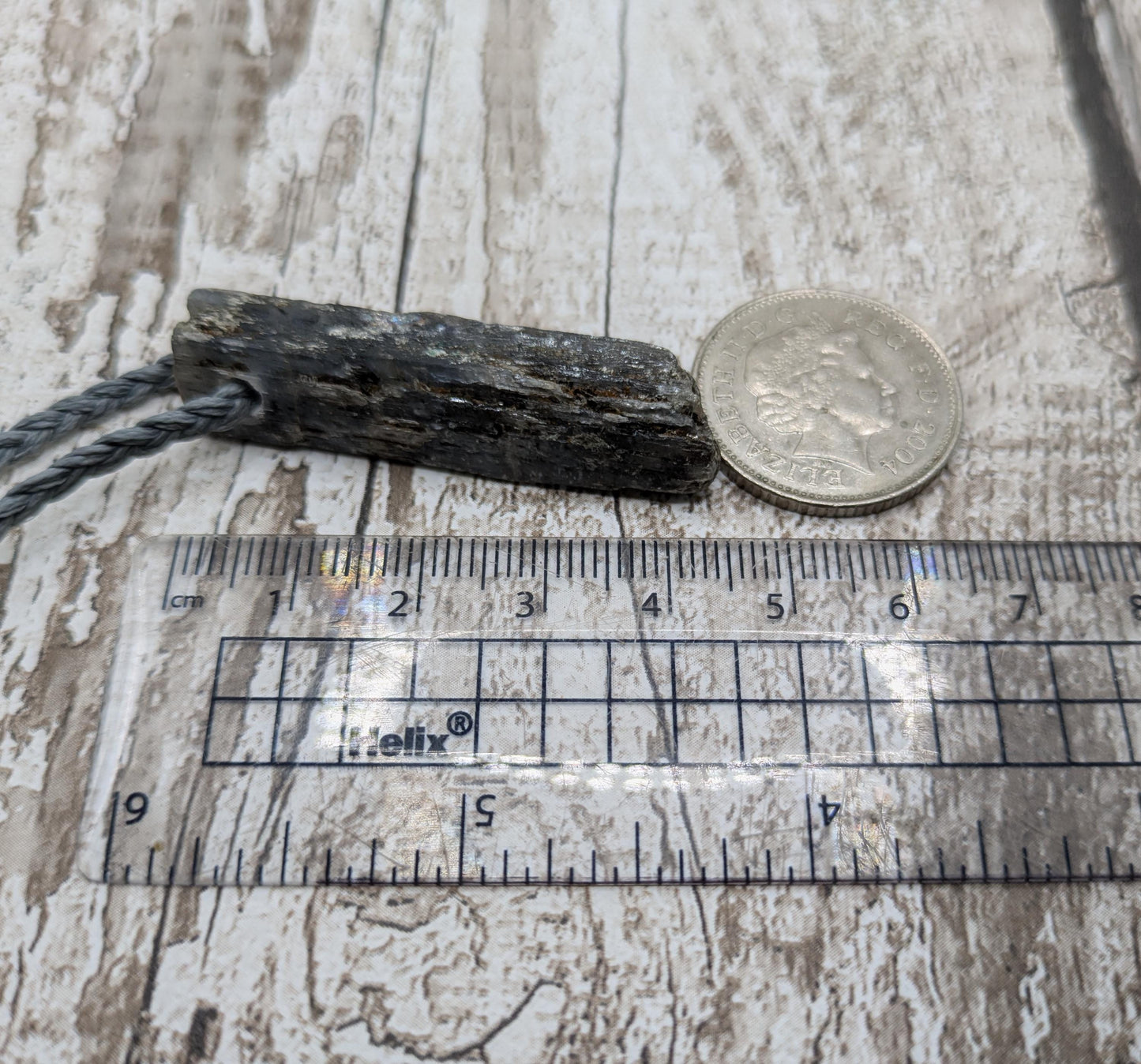 Raw kyanite pendant.