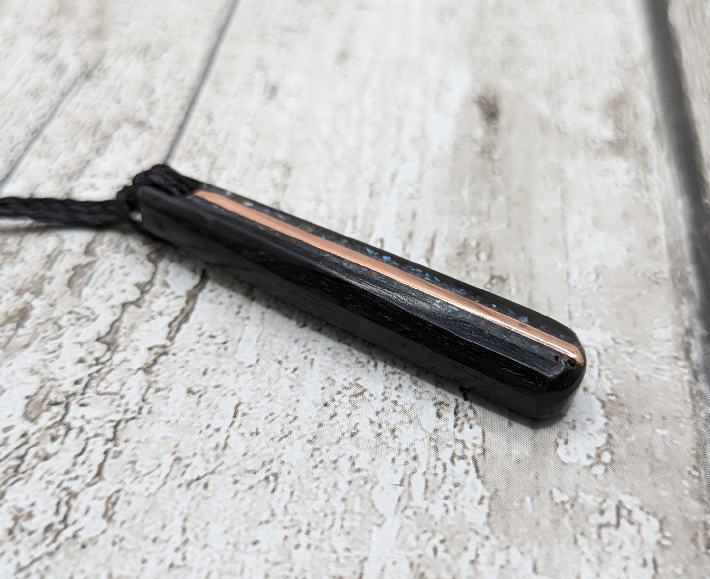 Fenland bog oak roimata pendants with mussel shell and copper wire