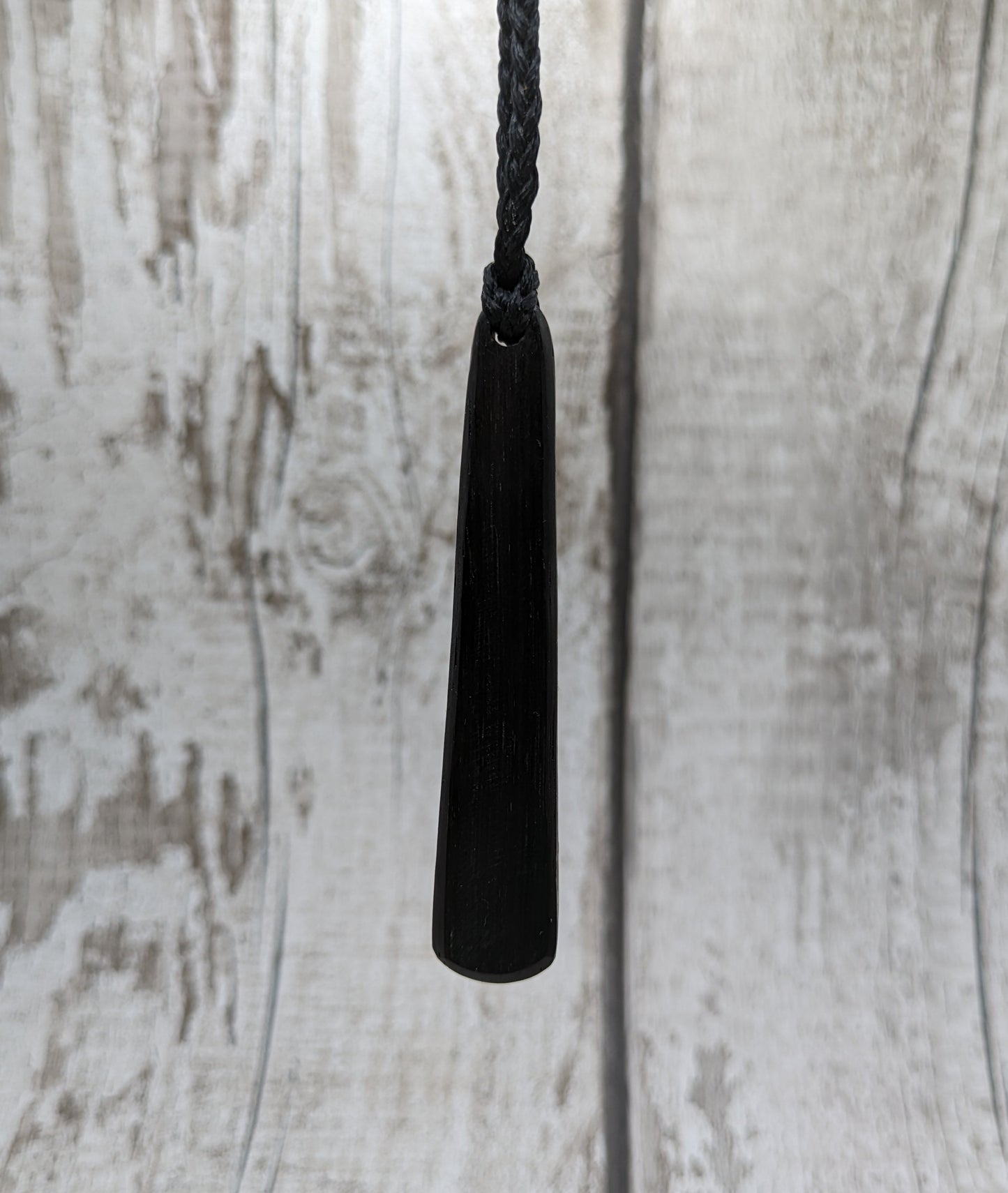 Fenland bog oak roimata with NZ greenstone pounamu pendant.