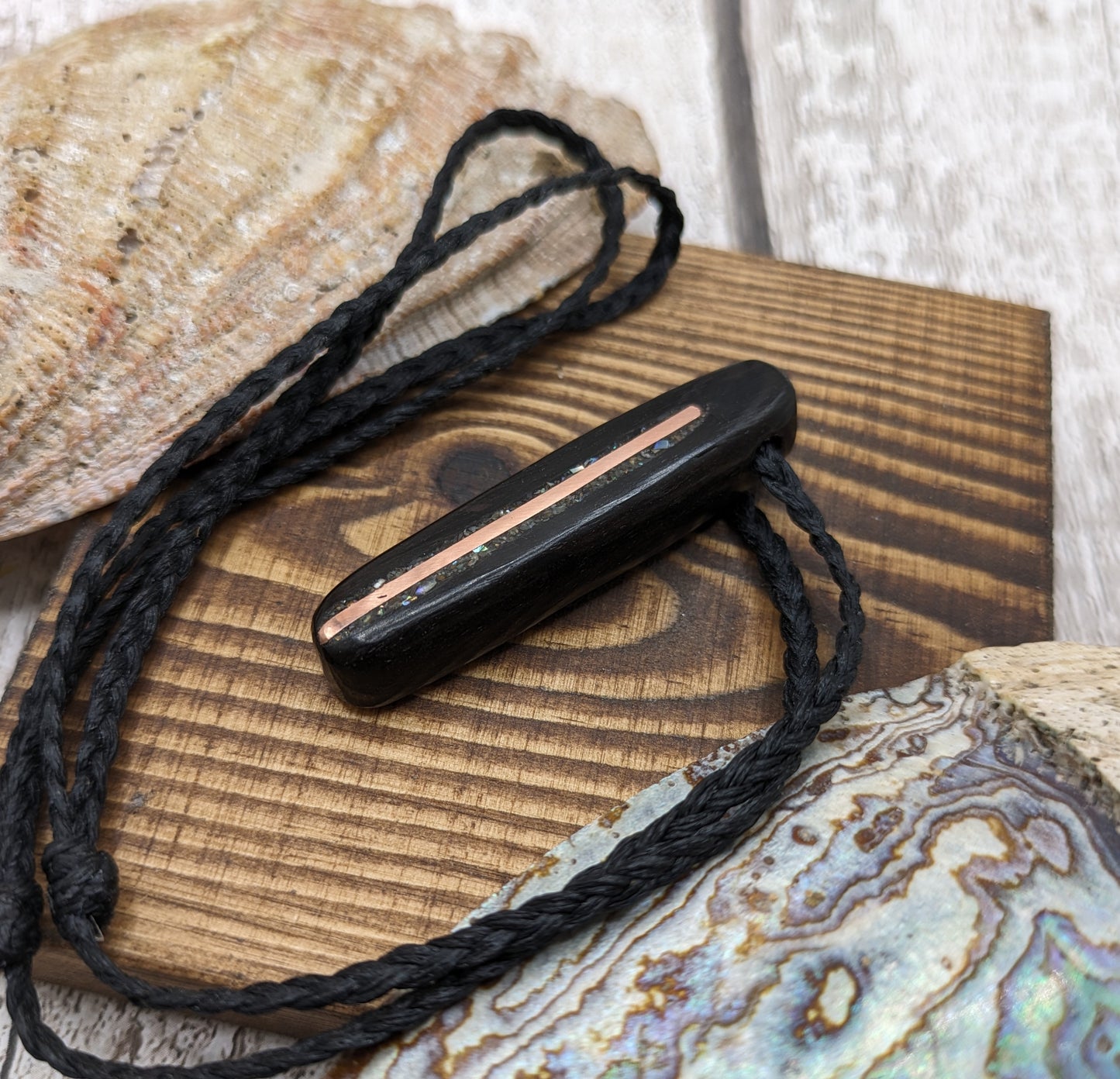 Fenland bog oak oval pendant with NZ pāua shell and copper wire