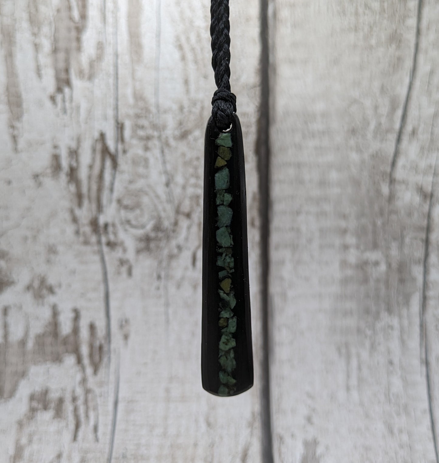 Fenland bog oak roimata with NZ greenstone pounamu pendant.