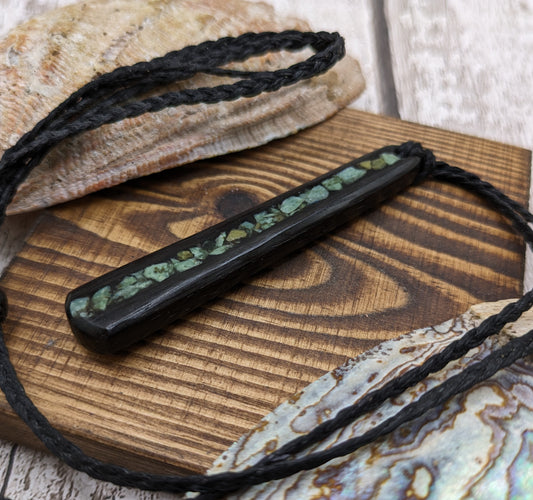 Fenland bog oak roimata with NZ greenstone pounamu pendant.