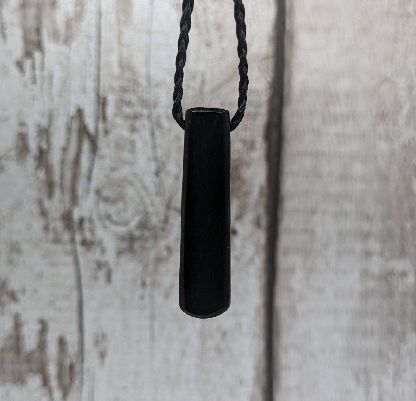 Fenland bog oak roimata pendant with mussel shell and copper wire