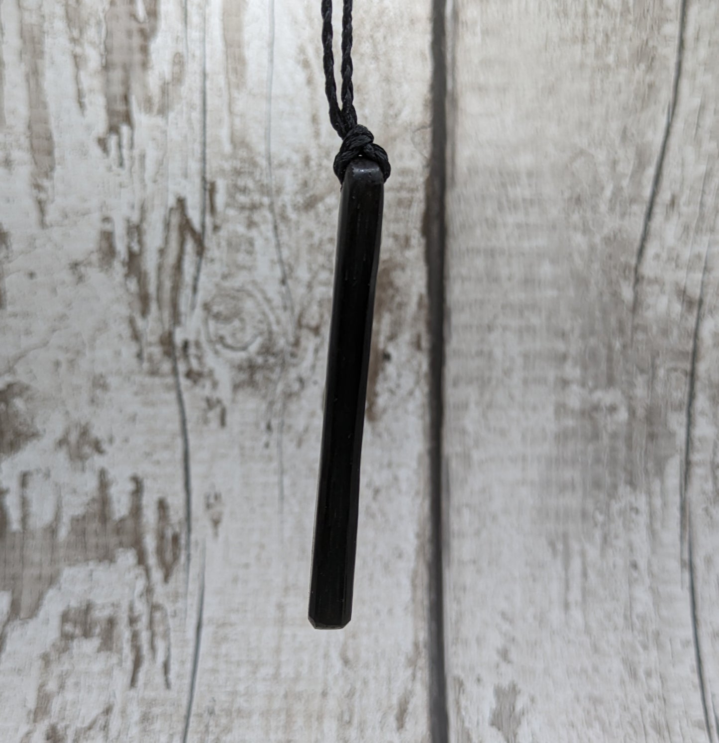 Fenland bog oak roimata with NZ greenstone pounamu pendant.