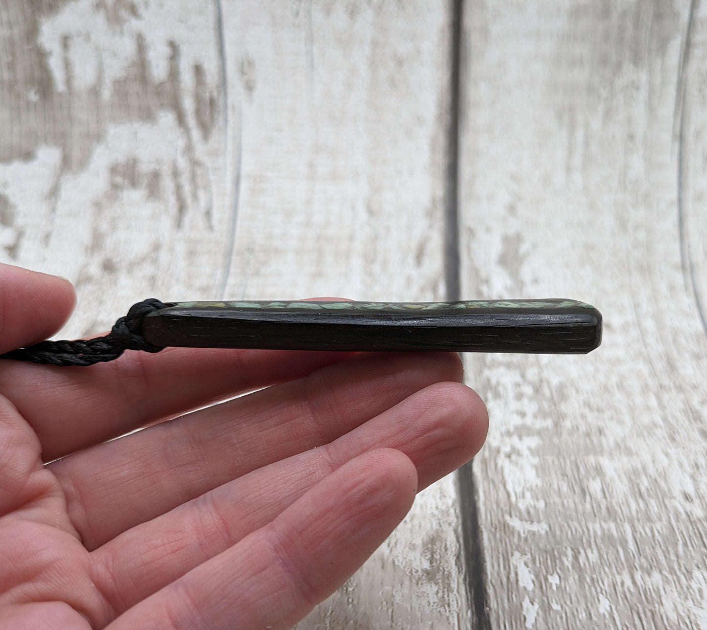 Fenland bog oak roimata with NZ greenstone pounamu pendant.