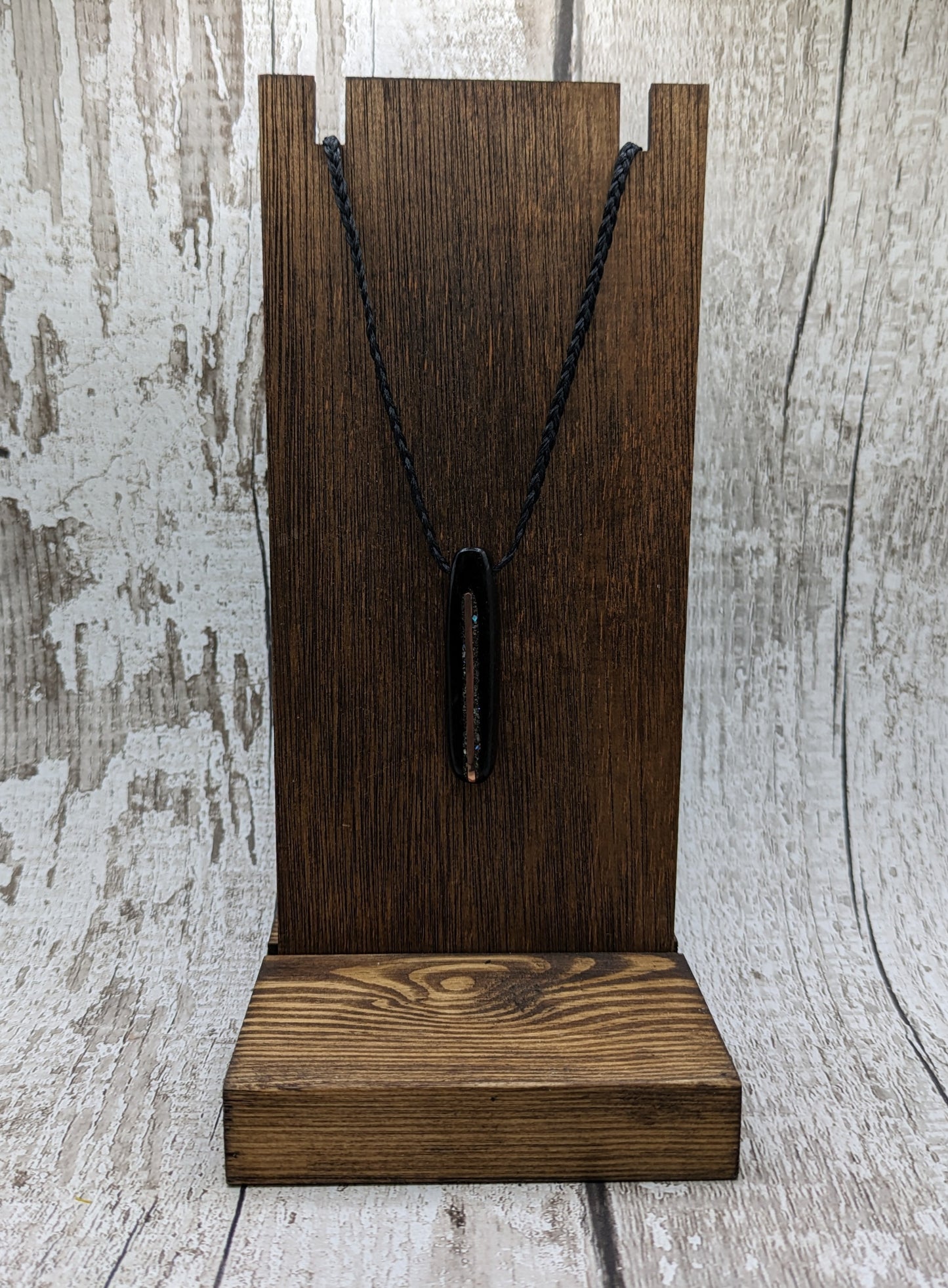 Fenland bog oak oval pendant with NZ pāua shell and copper wire