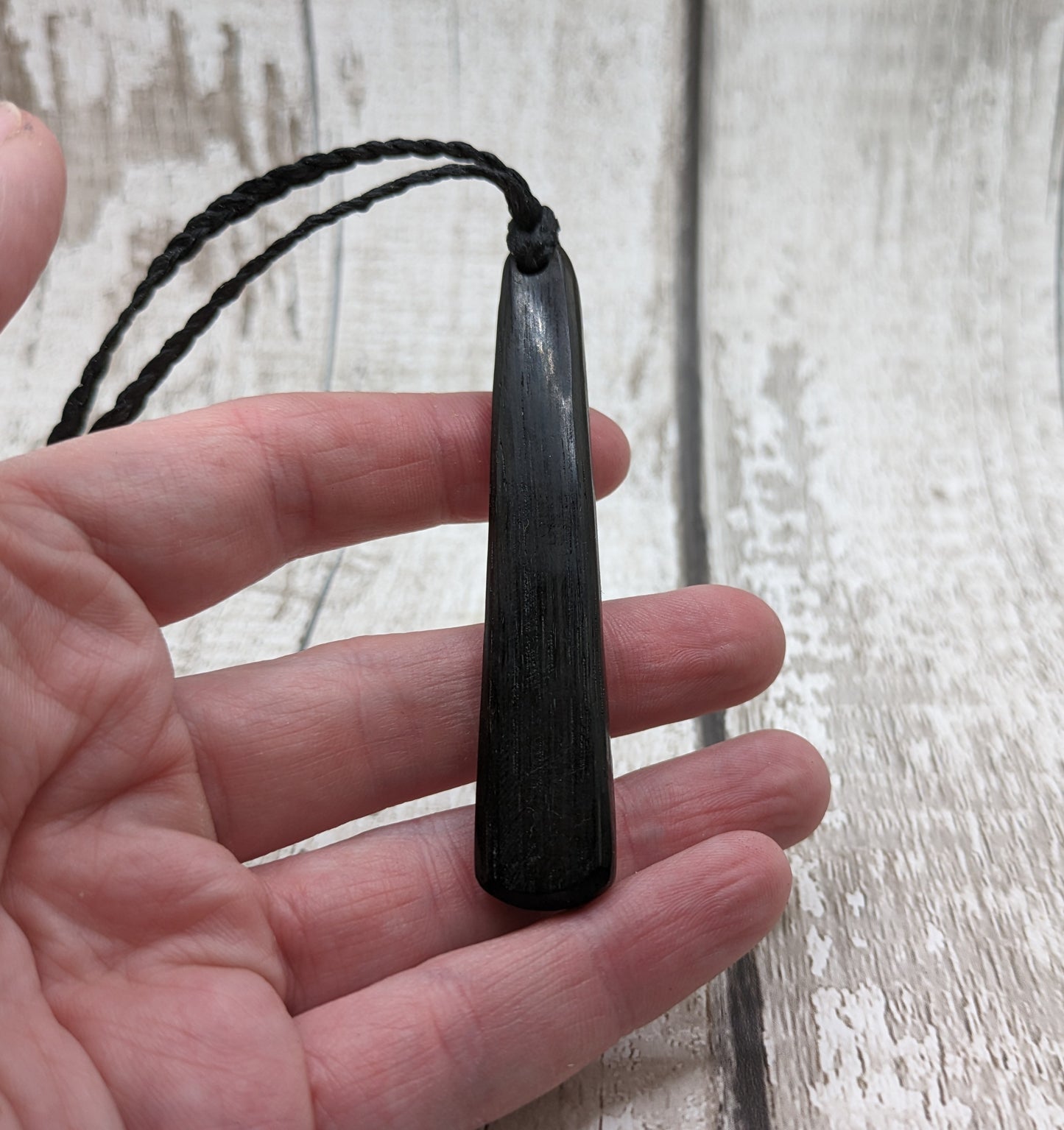 Fenland bog oak roimata with NZ greenstone pounamu pendant.