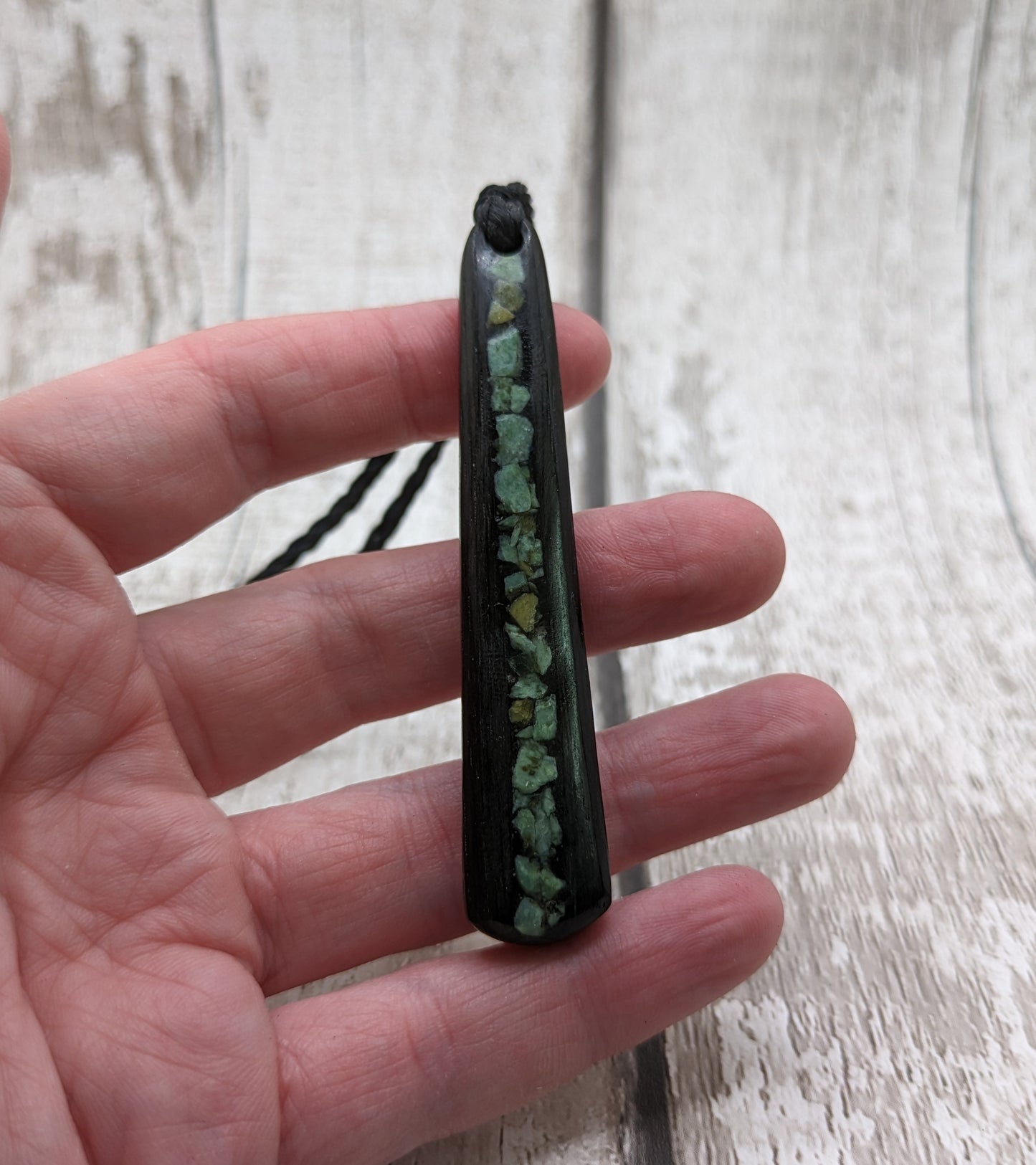 Fenland bog oak roimata with NZ greenstone pounamu pendant.