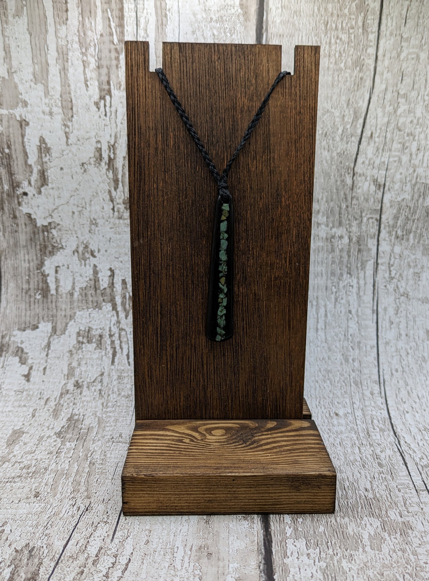 Fenland bog oak roimata with NZ greenstone pounamu pendant.