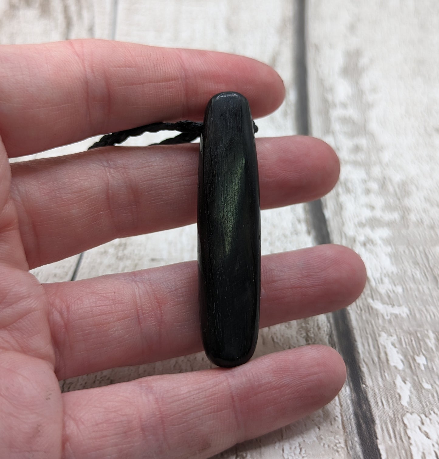 Fenland bog oak oval pendant with NZ pāua shell and copper wire