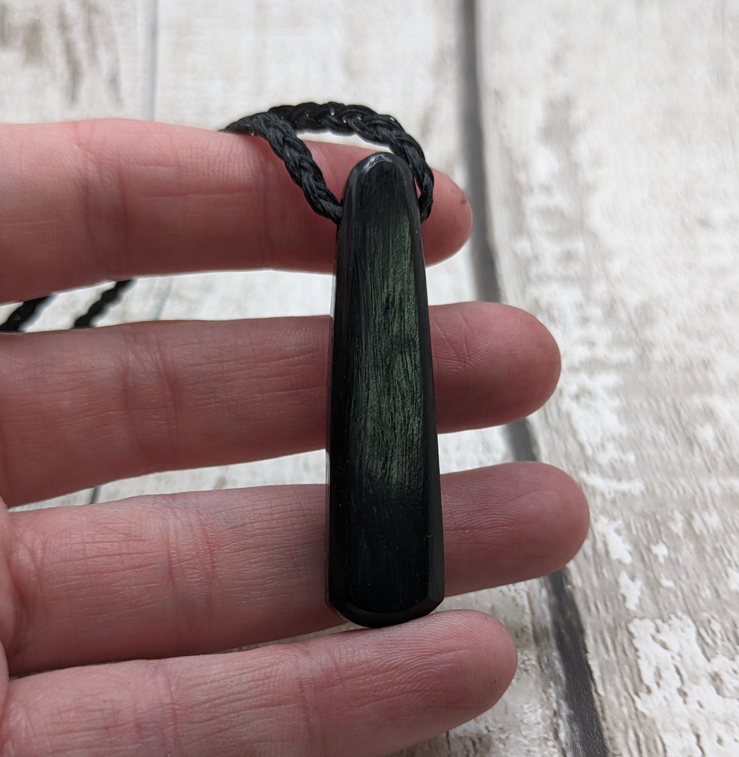 Fenland my bog oak roimata pendant with NZ pāua shell and copper wire.