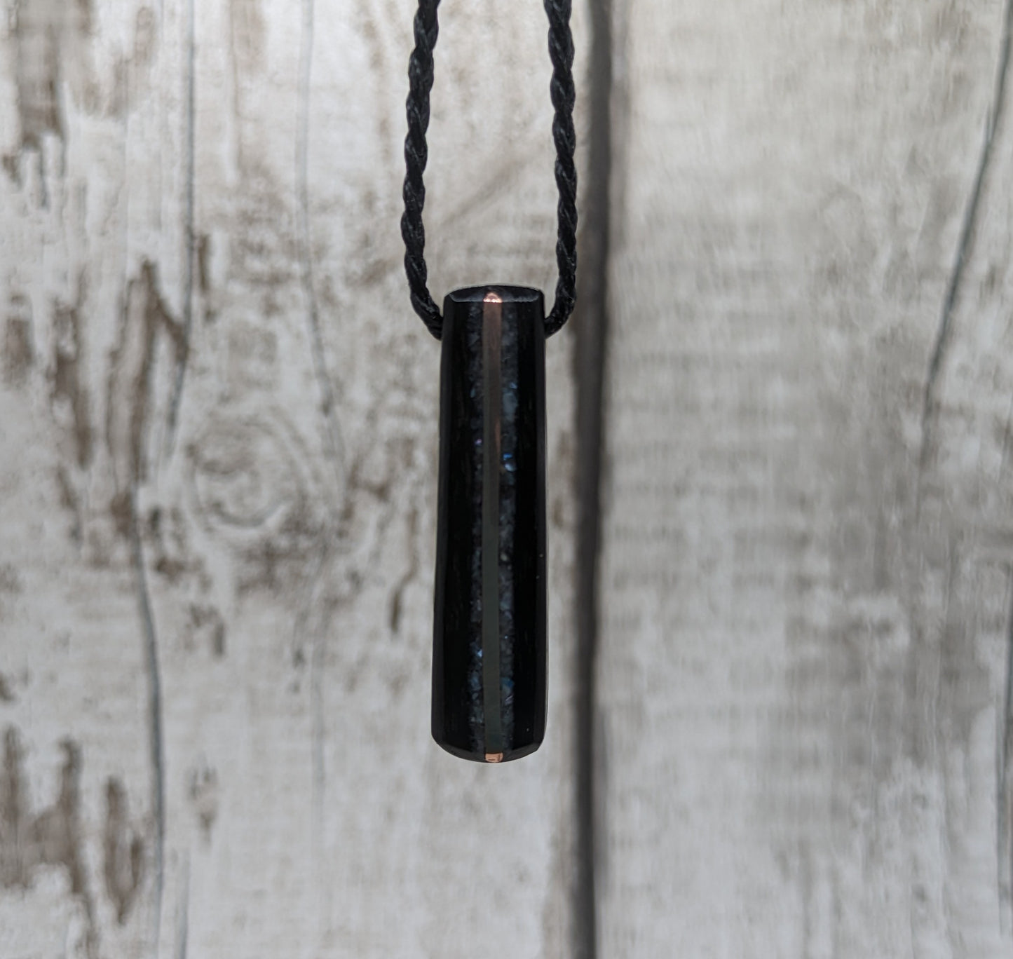 Fenland bog oak roimata pendant with mussel shell and copper wire