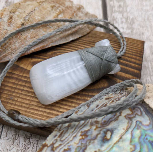 Selenite satin spar hei toki adze pendant.