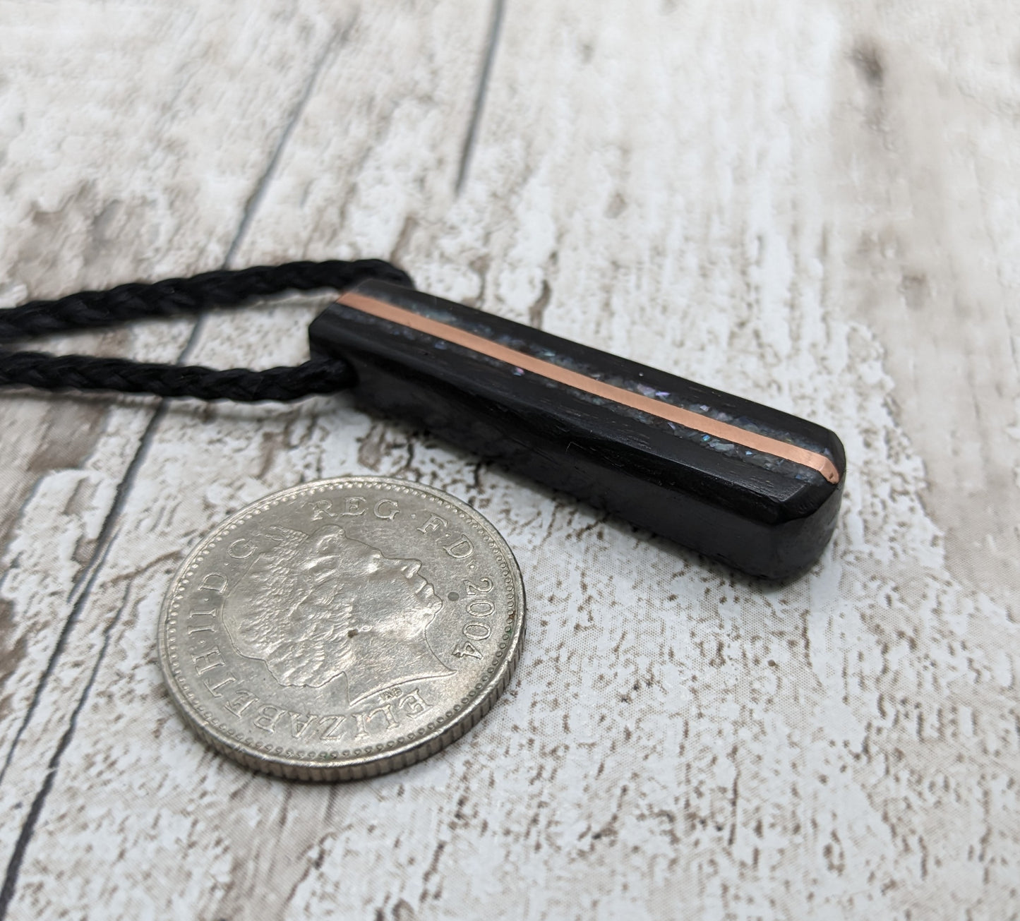 Fenland bog oak roimata pendant with mussel shell and copper wire