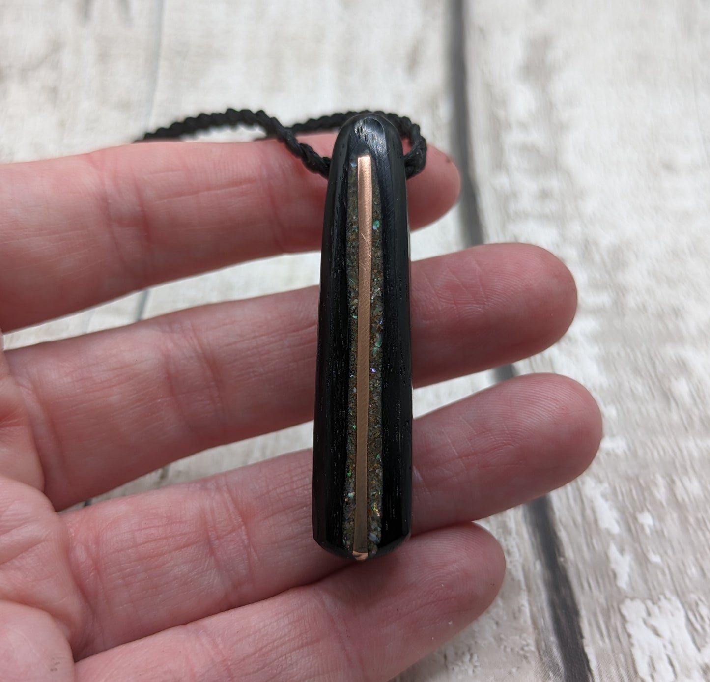 Fenland bog oak roimata pendant with copper wire and abalone shell.