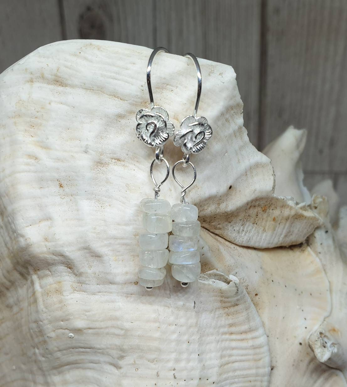 Spectrolite moonstone on 925 sterling silver fish hook earrings with rose detail.