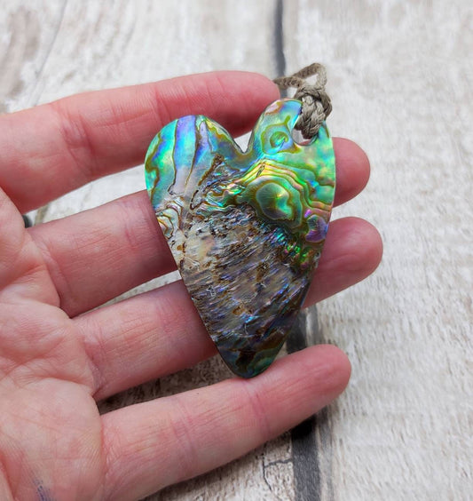 New Zealand rainbow paua abalone shell heart shaped pendant.